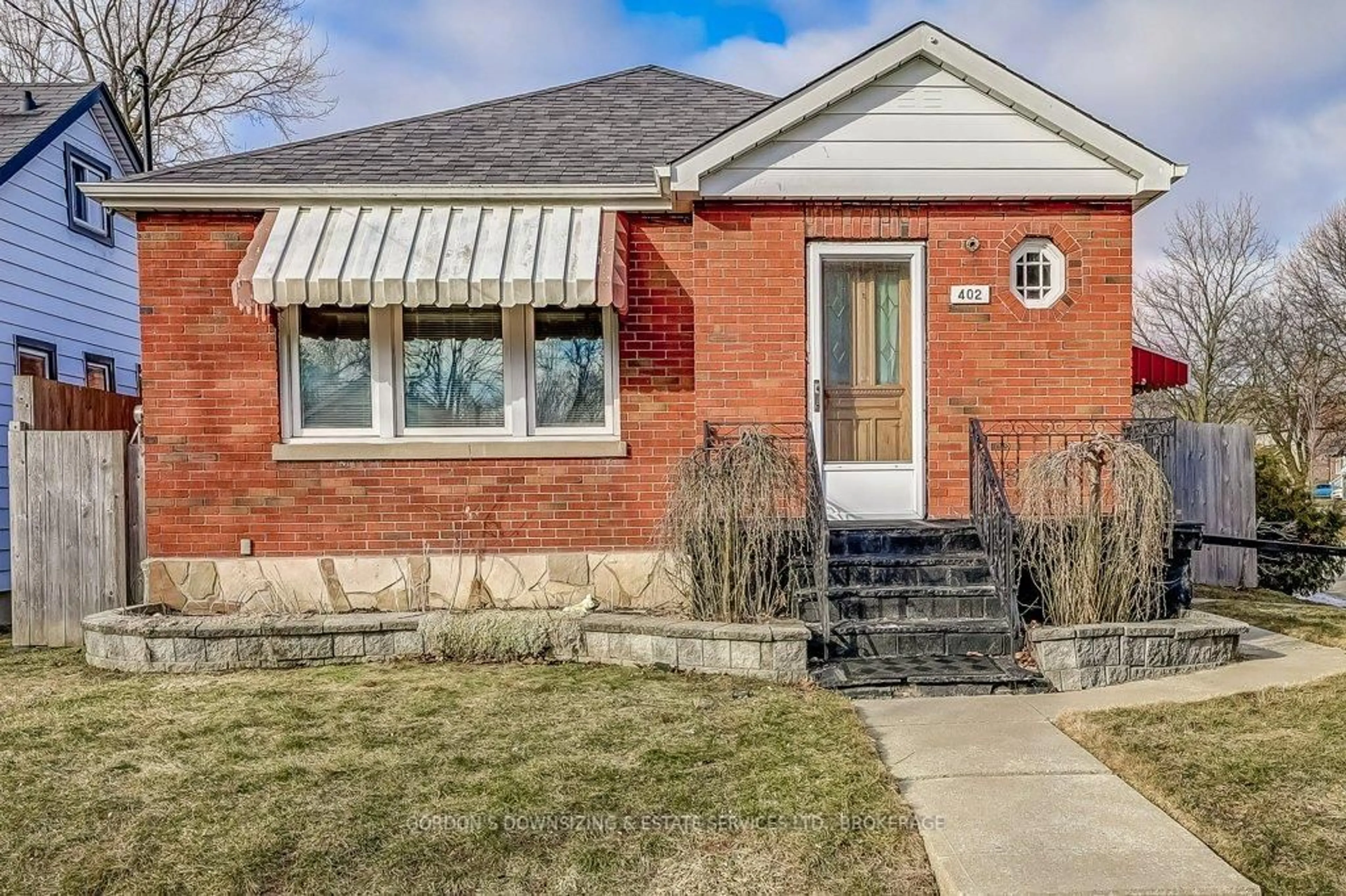 Home with brick exterior material, street for 402 Division St, Oshawa Ontario L1G 5M9