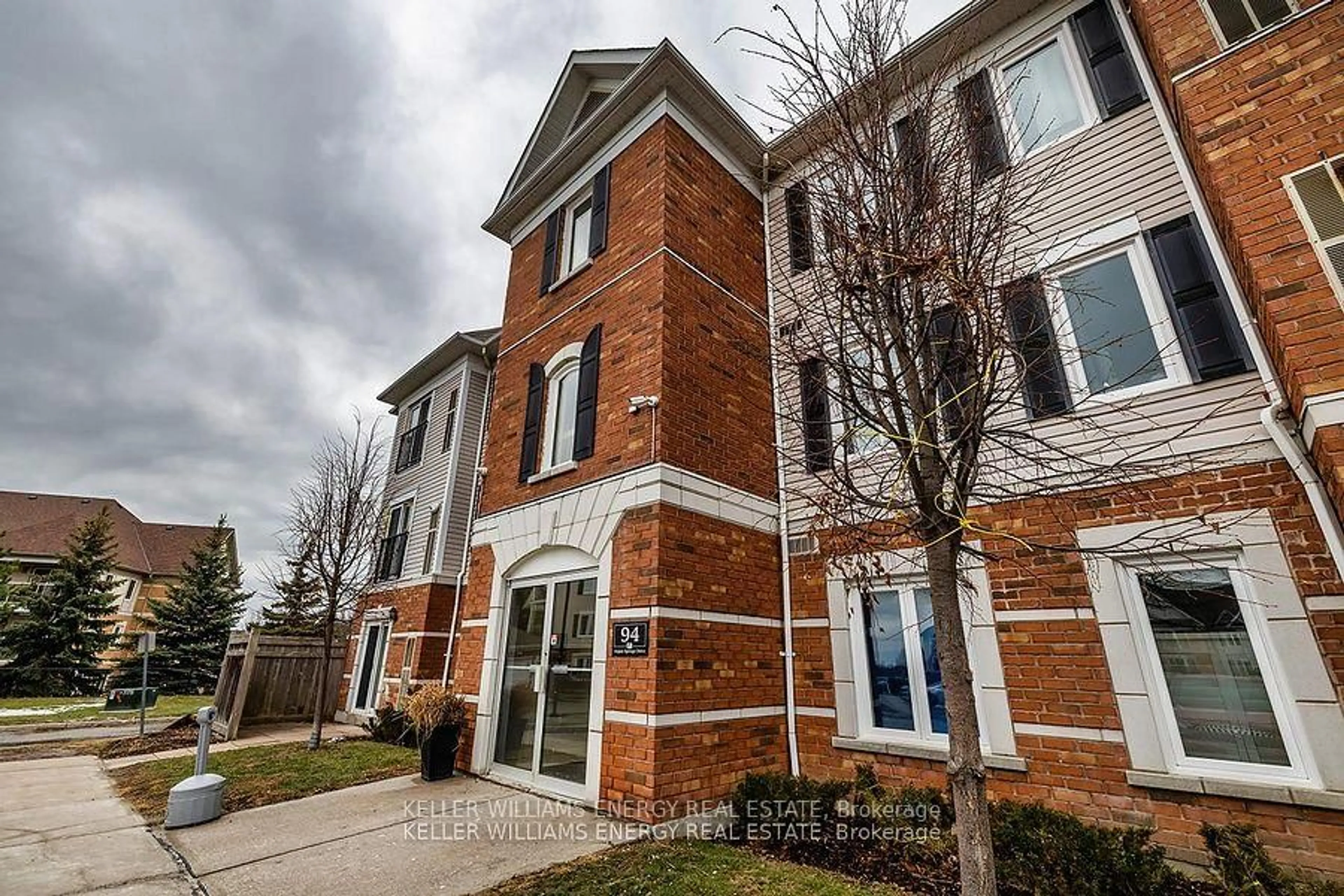 Home with brick exterior material, street for 94 Aspen Springs Dr #204, Clarington Ontario L1C 5N4
