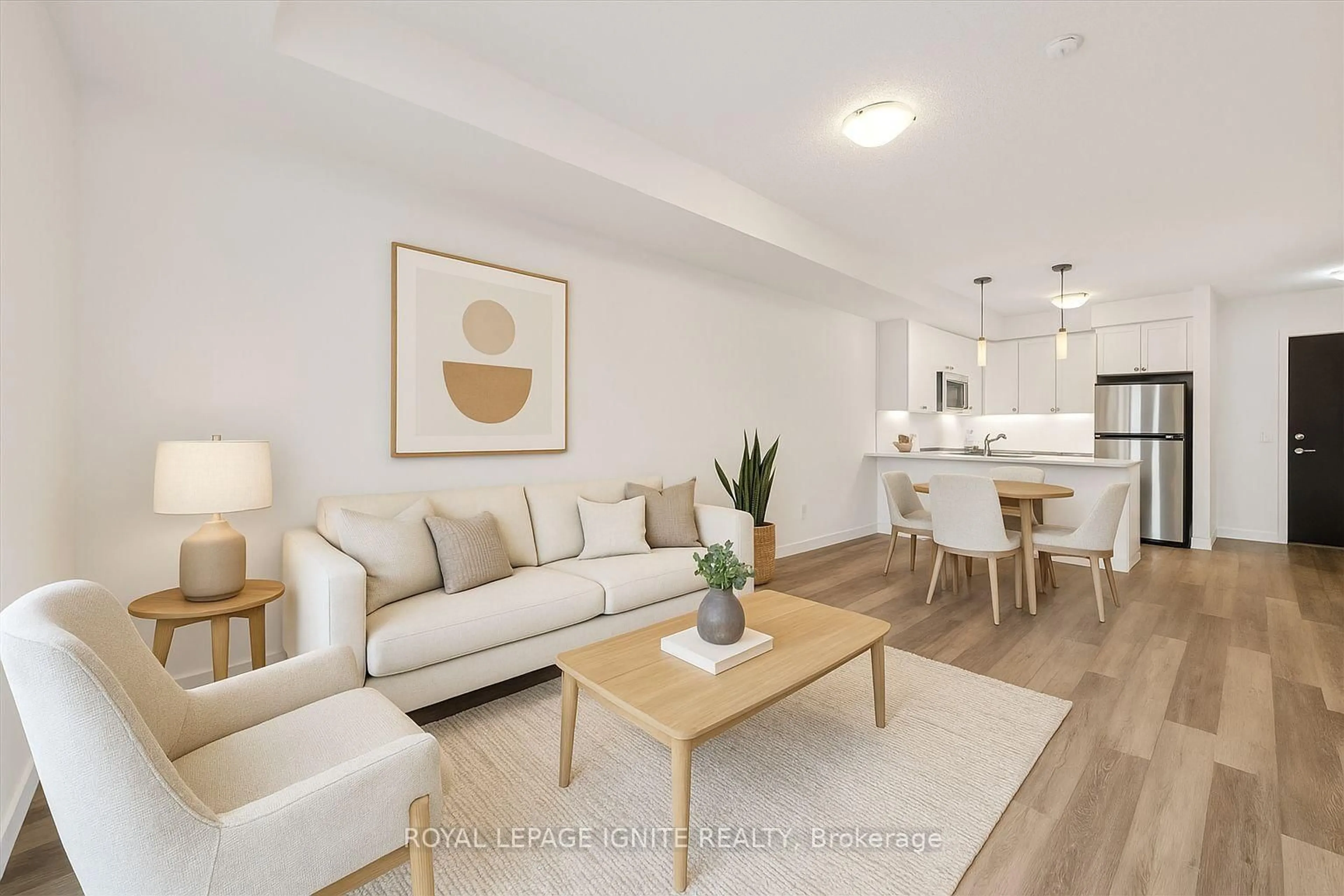 Living room with furniture, wood/laminate floor for 50 Lakebreeze Dr #228, Clarington Ontario L1B 0V9