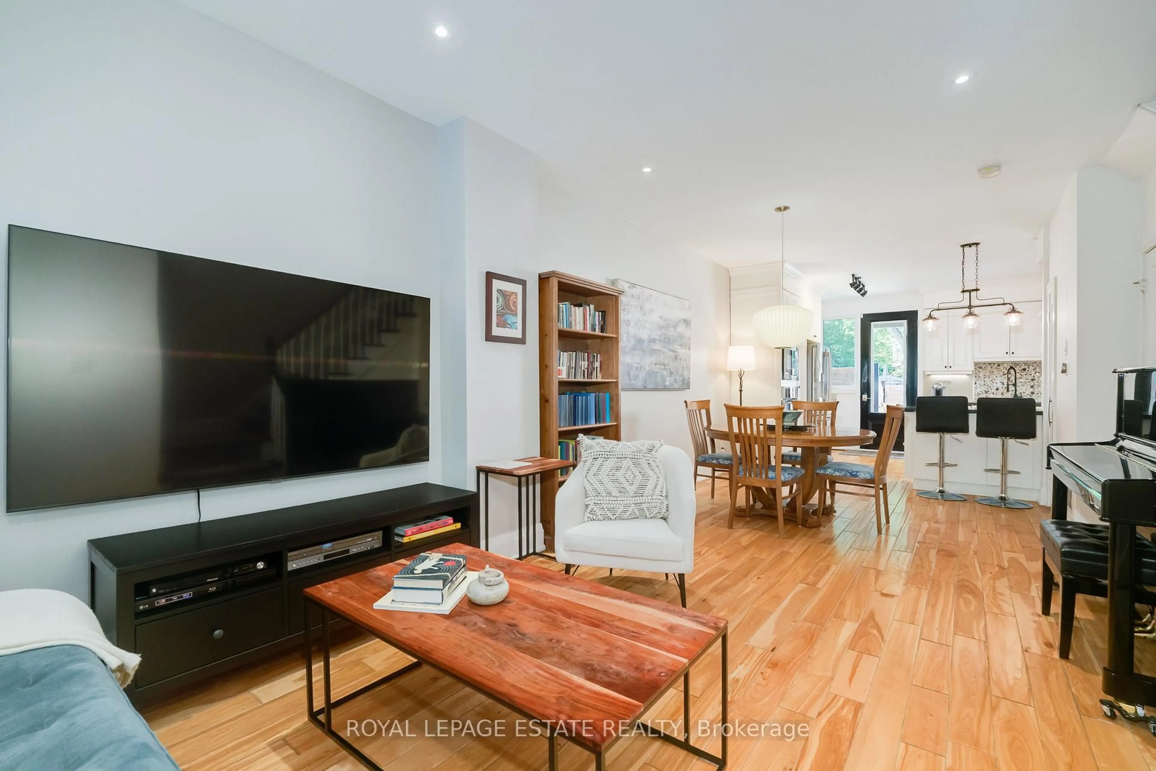 Living room with furniture, wood/laminate floor for 18 Bastedo Ave, Toronto Ontario M4C 3M7