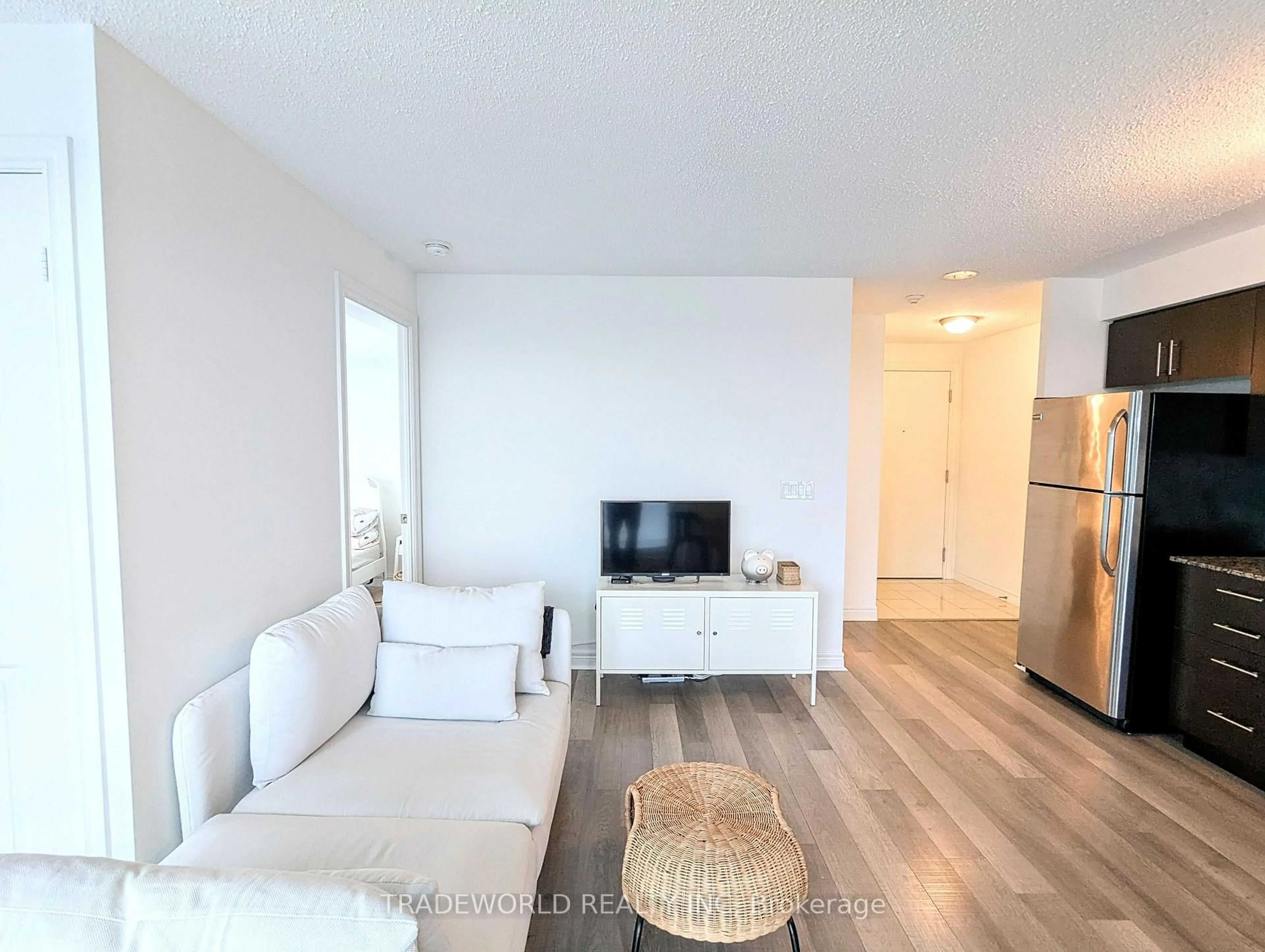 Living room with furniture, wood/laminate floor for 50 Town Centre Crt #3304, Toronto Ontario M1P 0A9