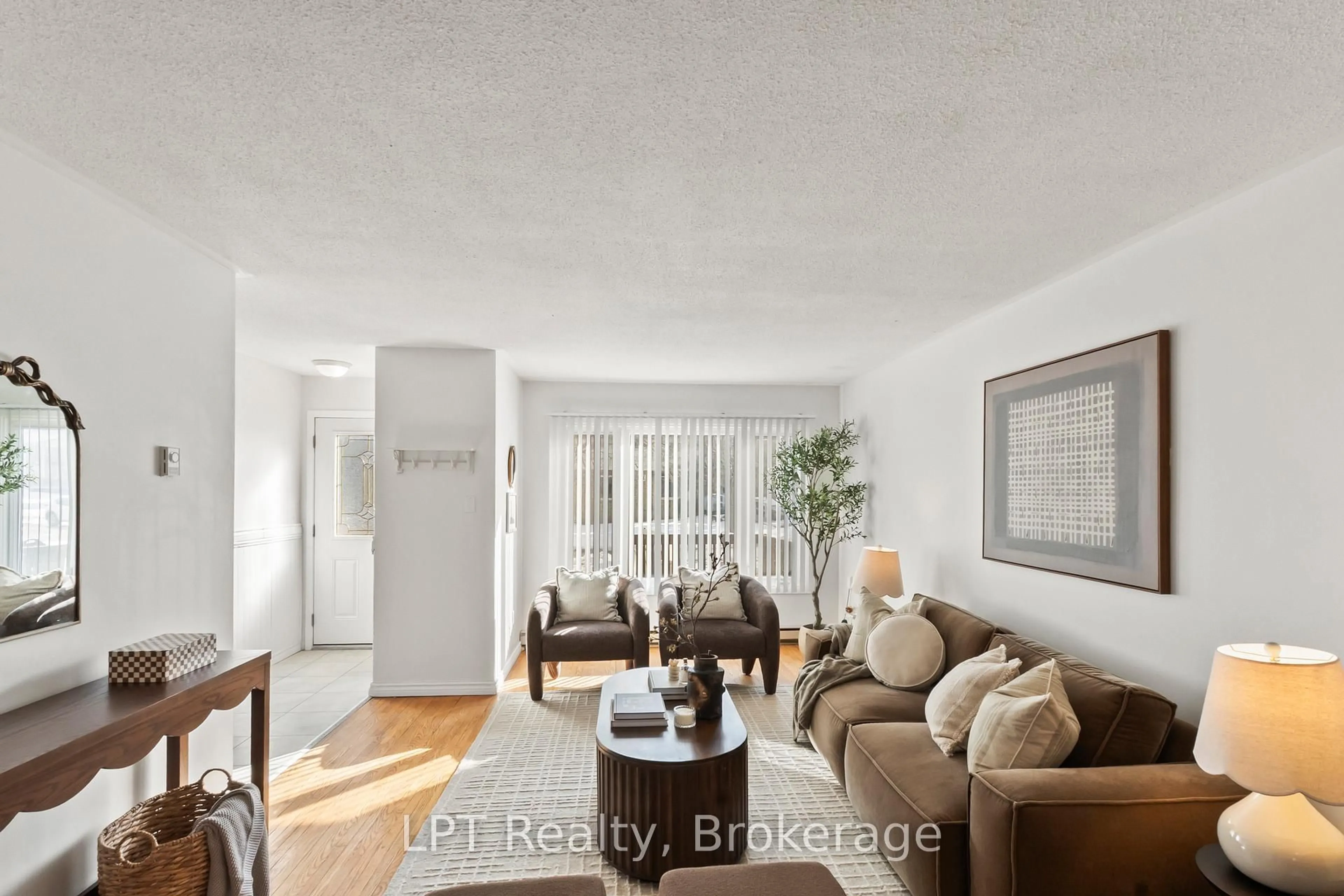 Living room with furniture, wood/laminate floor for 118 Capreol Crt, Oshawa Ontario L1J 6E6