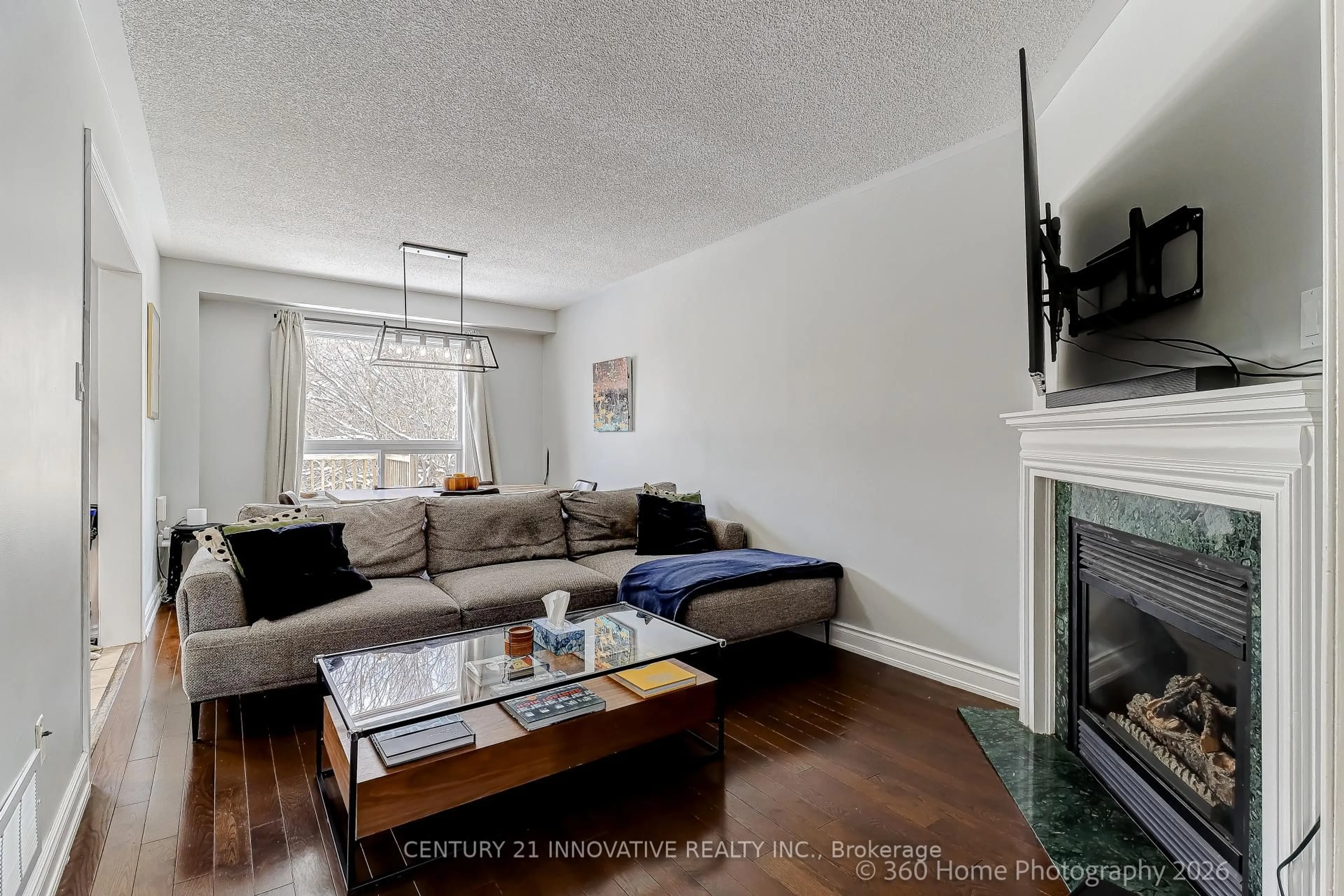 Living room with furniture, wood/laminate floor for 1896 Woodgate Crt, Oshawa Ontario L1G 7Z2