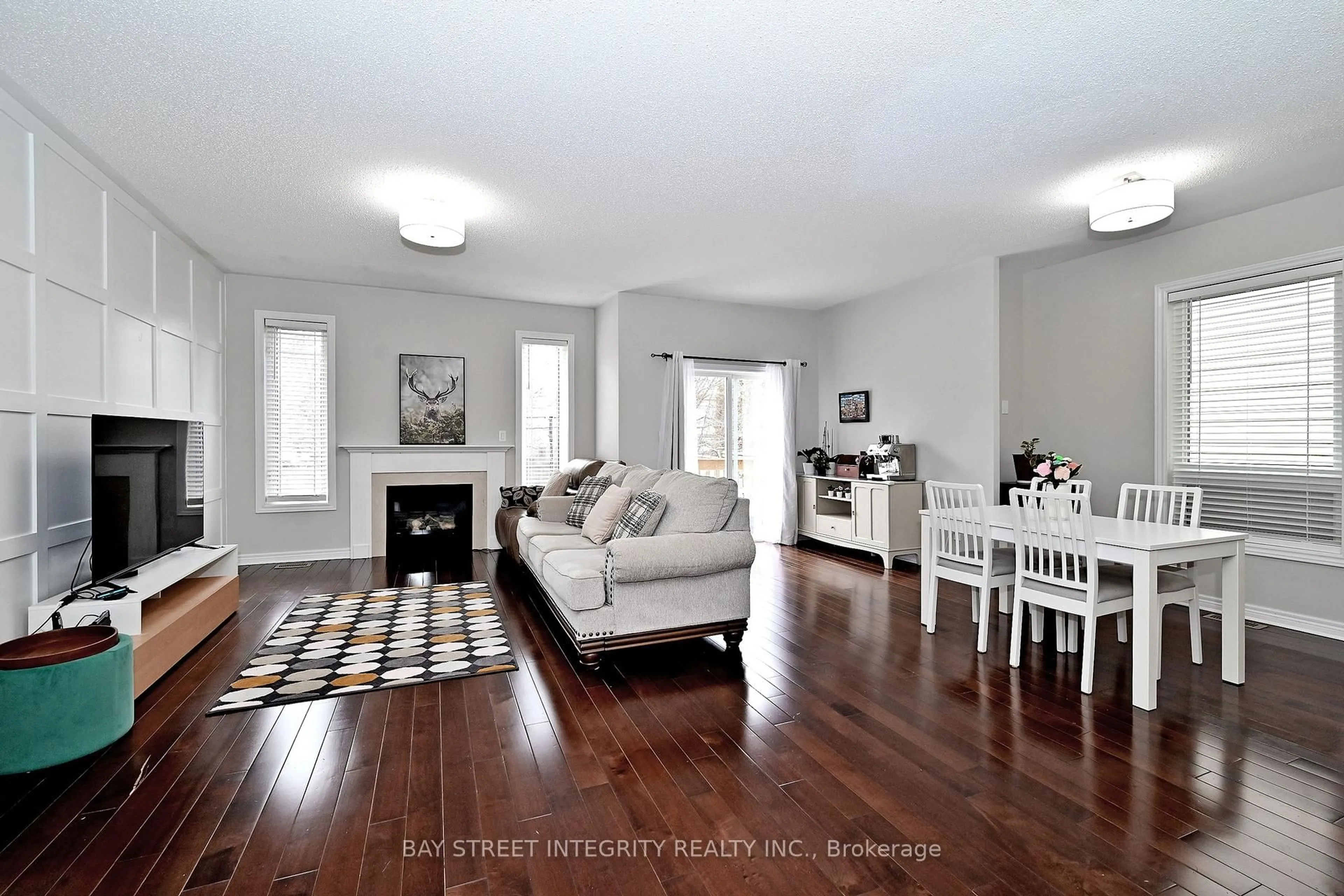 Living room with furniture, wood/laminate floor for 60 Darius Harns Dr, Whitby Ontario L1M 2G6