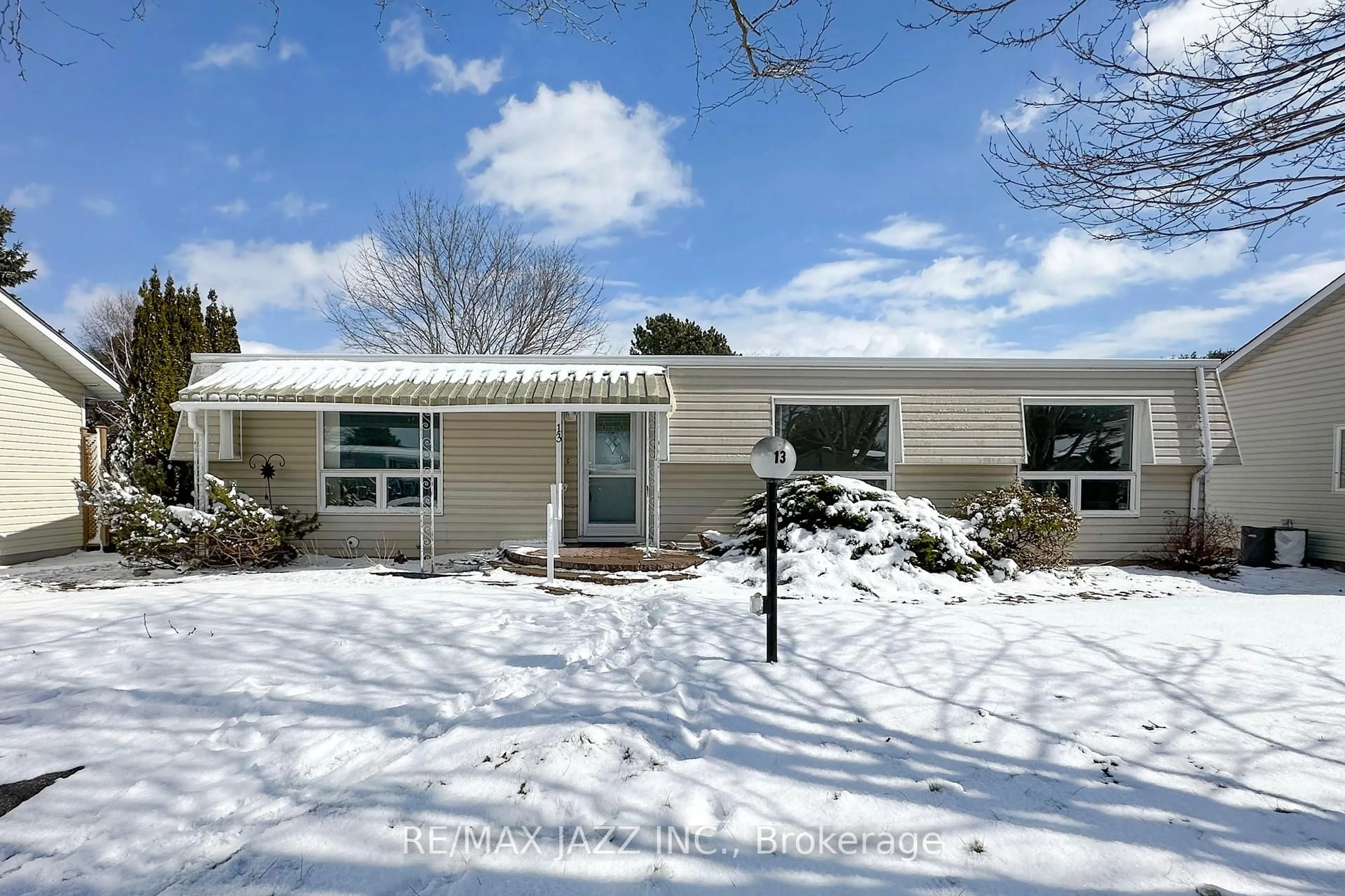 Home with vinyl exterior material, street for 13 Steelhead Lane, Clarington Ontario L1B 1B4