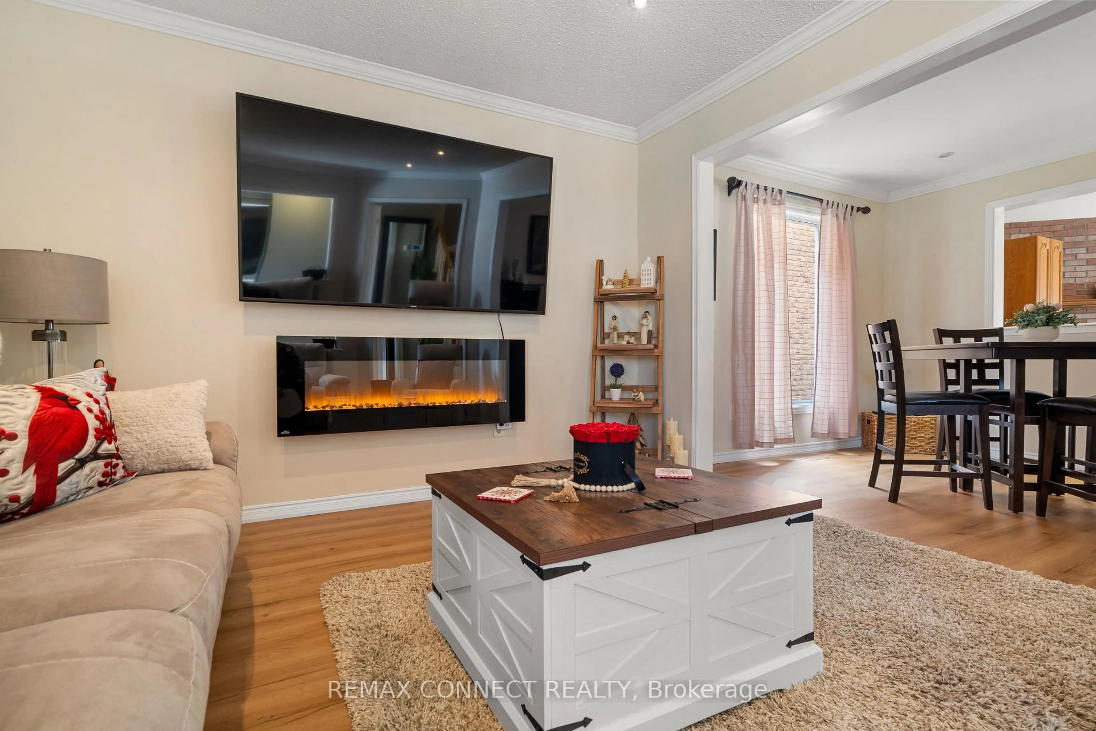 Living room with furniture, wood/laminate floor for 52 Marshall Cres, Ajax Ontario L1T 2N4