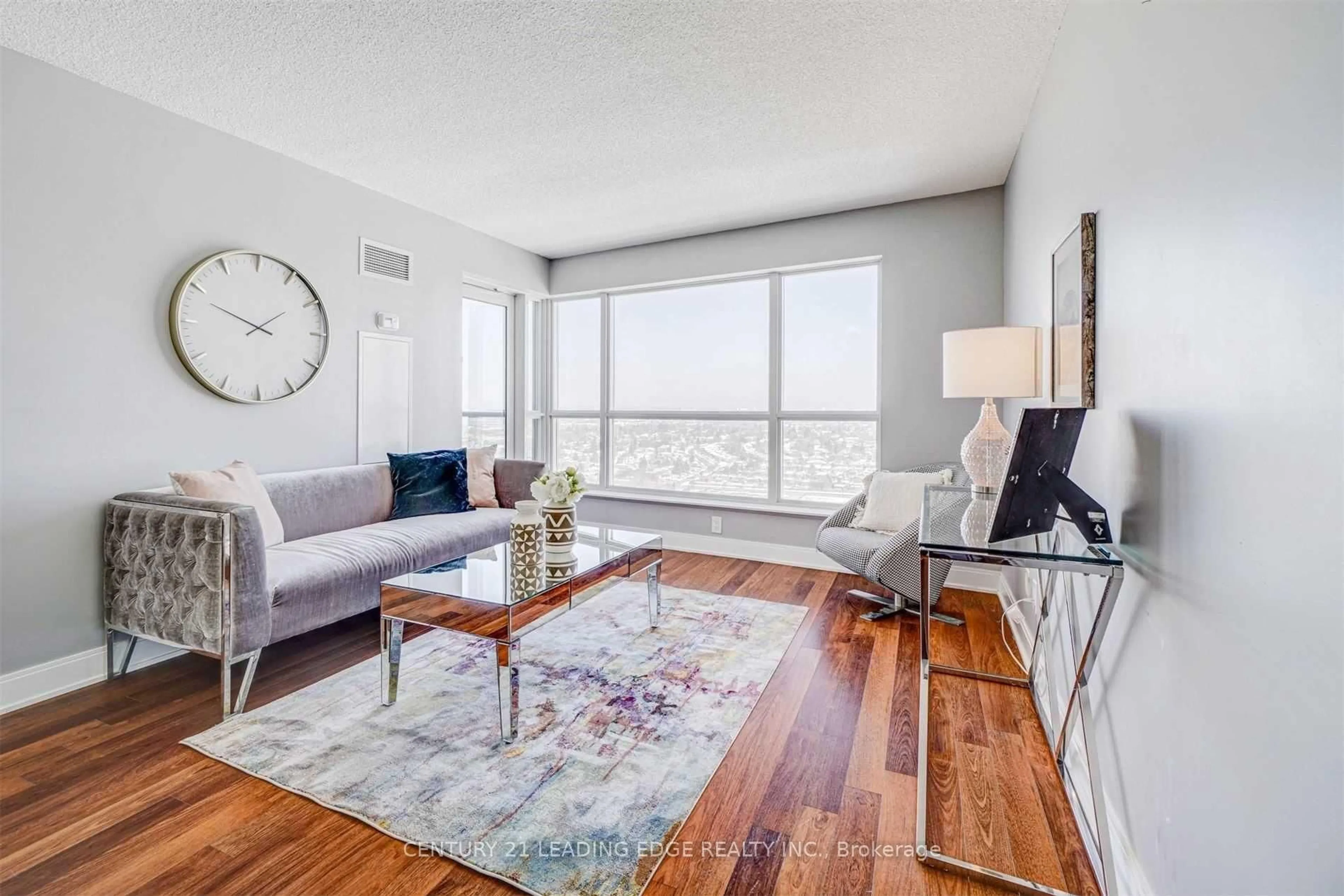 Living room with furniture, wood/laminate floor for 135 Village Green Sq #2415, Toronto Ontario M1S 0G4