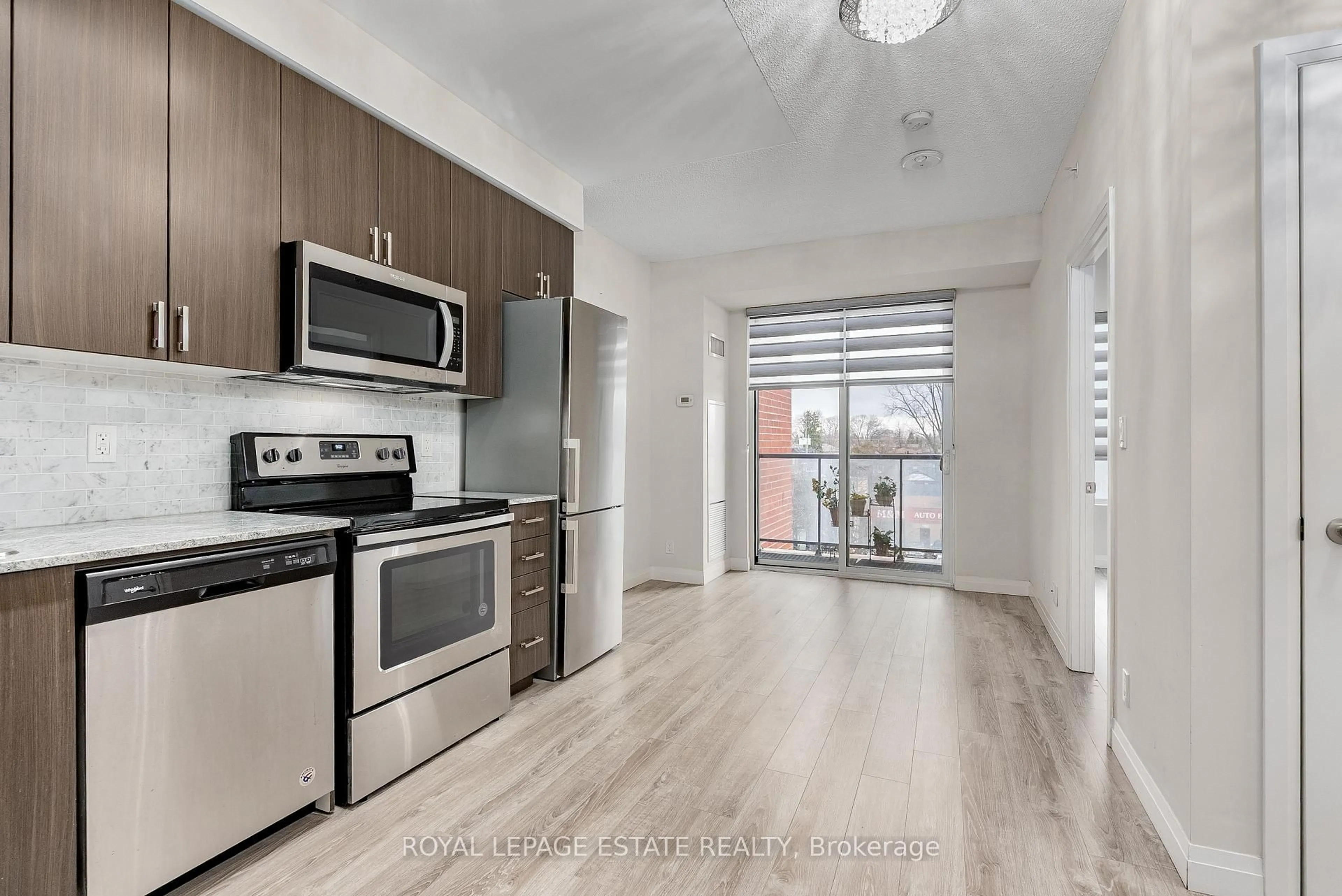 Open concept kitchen, wood/laminate floor for 22 East Haven Dr #501, Toronto Ontario M1N 0B4