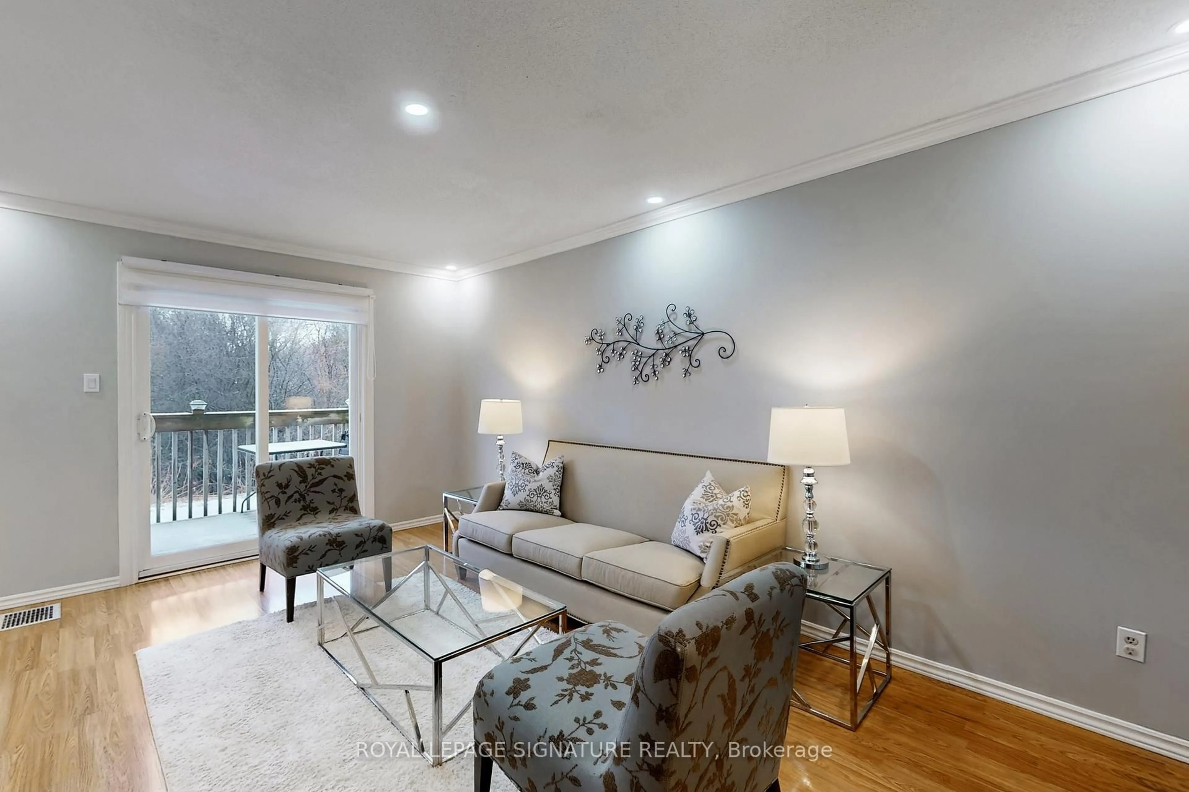 Living room with furniture, wood/laminate floor for 700 Harmony Rd #76, Oshawa Ontario L1K 1S2