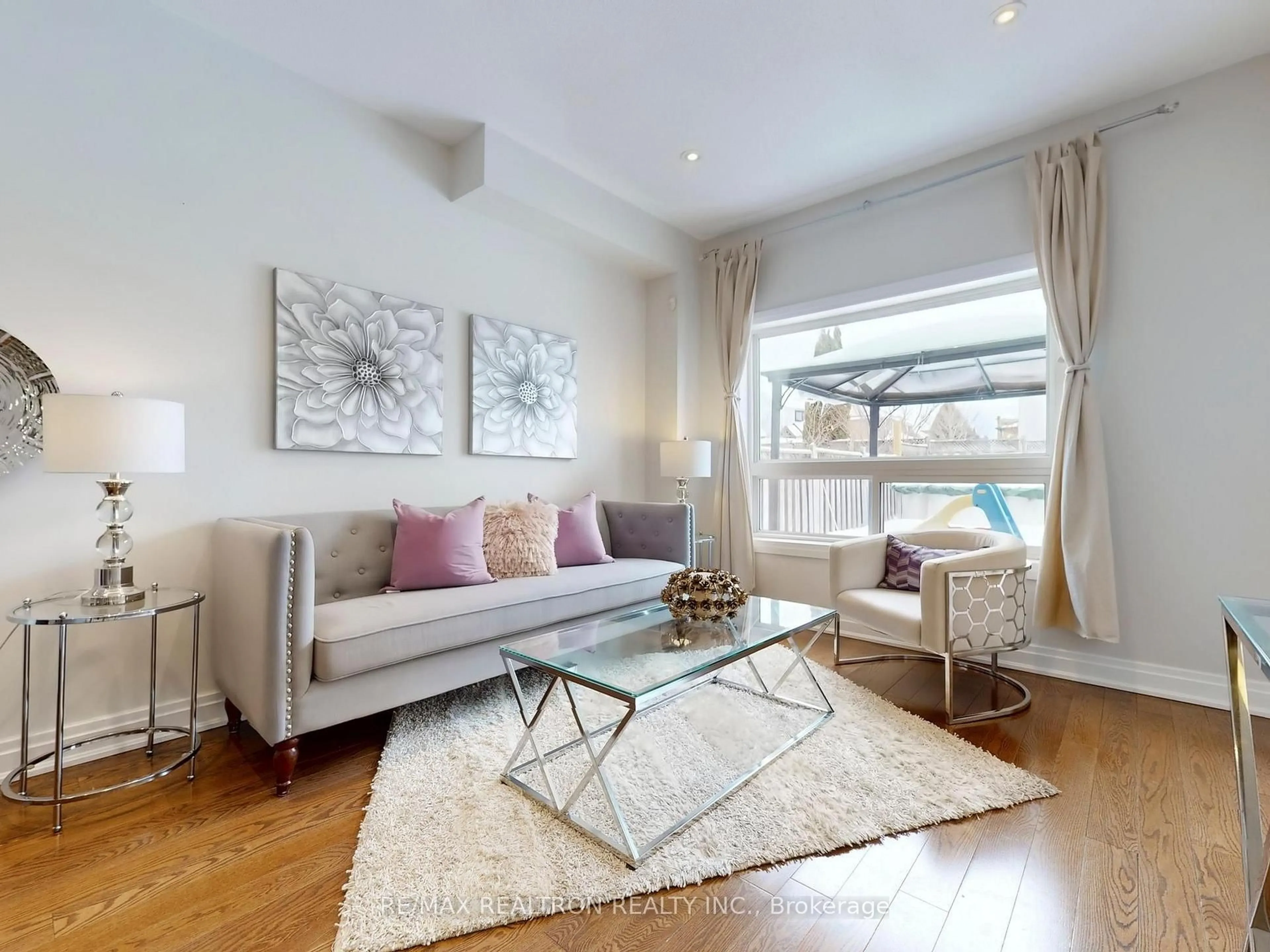 Living room with furniture, wood/laminate floor for 4 Wessex Dr, Whitby Ontario L1M 2C4