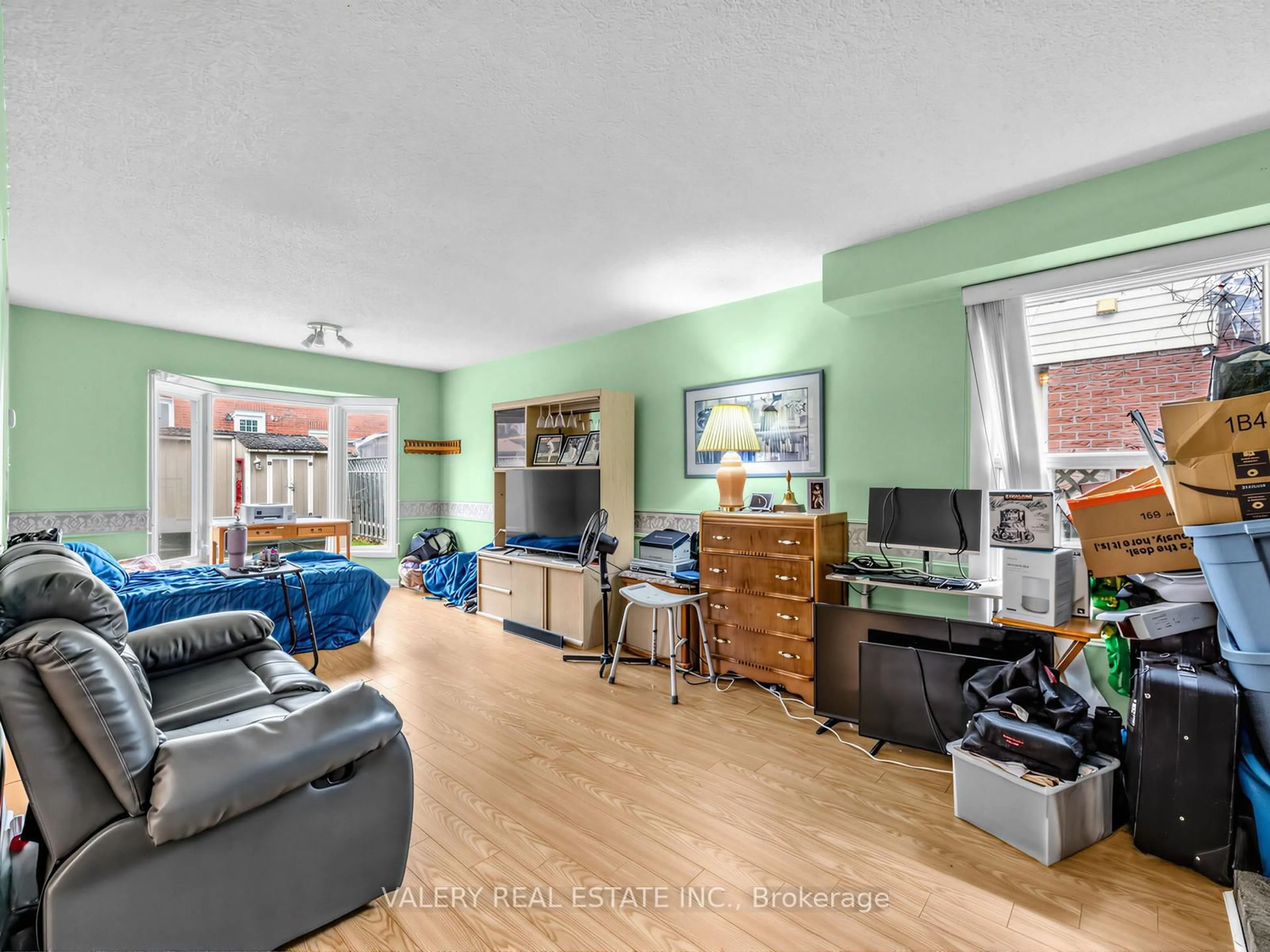 Living room with furniture, wood/laminate floor for 1610 Rawlings Dr, Pickering Ontario L1V 5B5