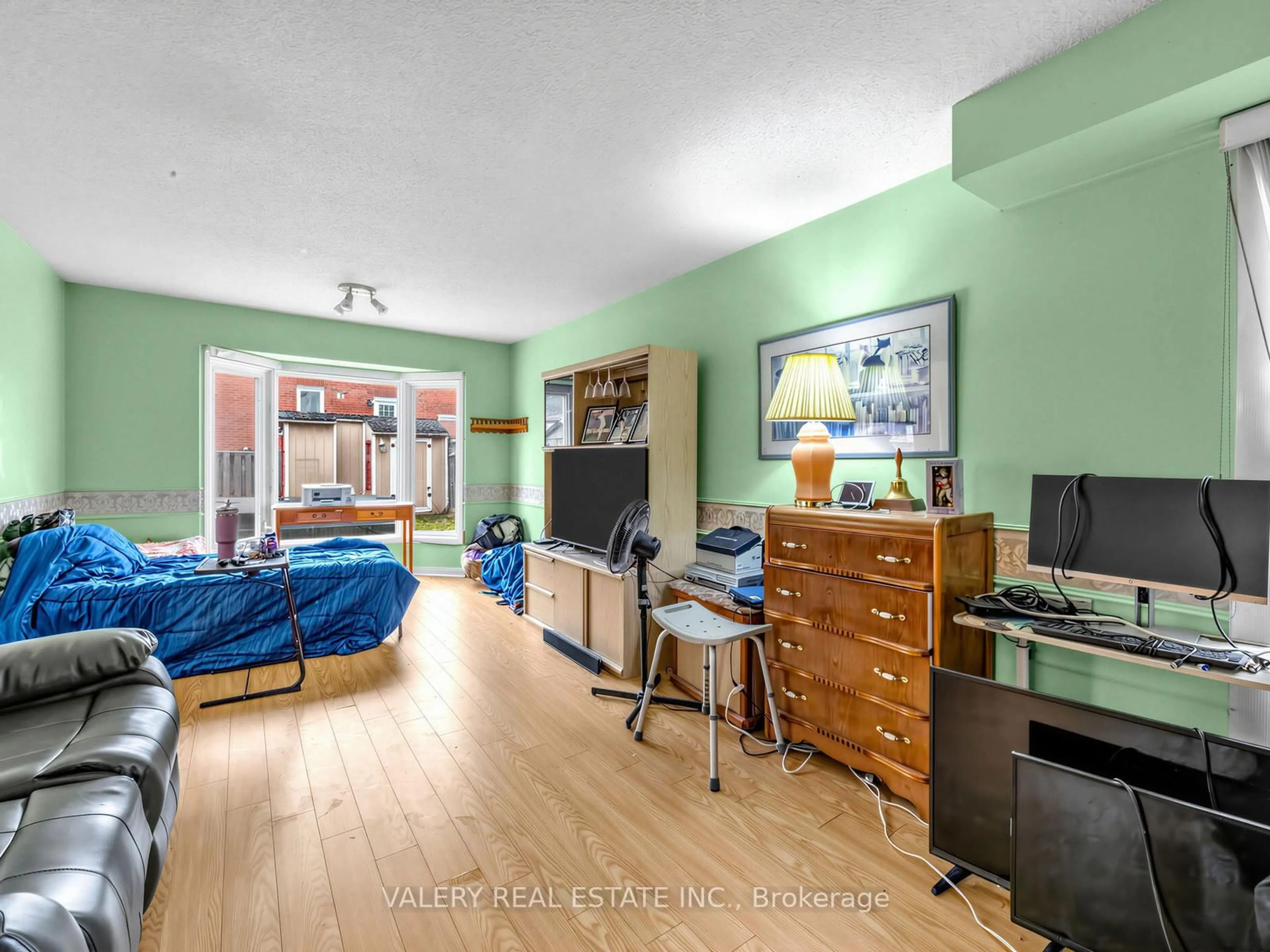 Living room with furniture, wood/laminate floor for 1610 Rawlings Dr, Pickering Ontario L1V 5B5