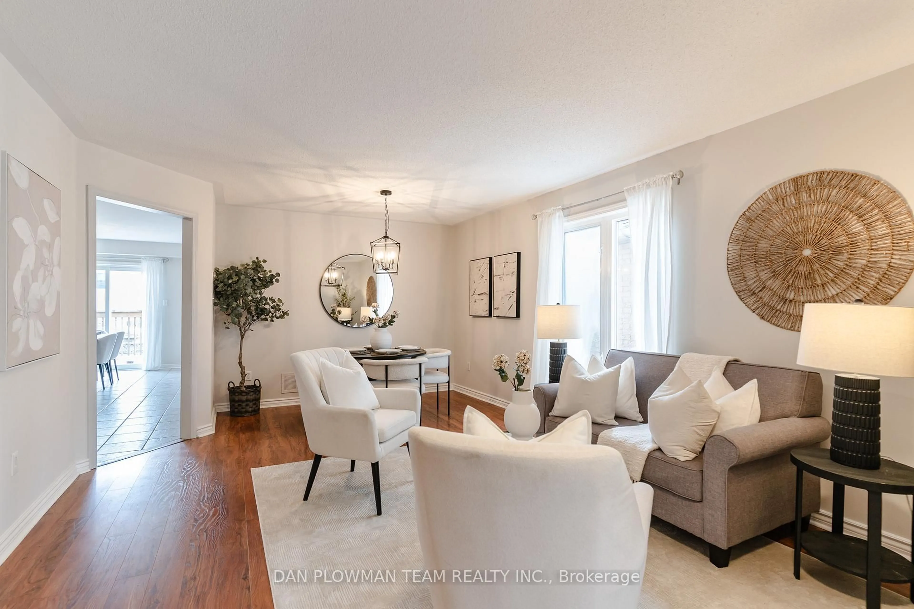 Living room with furniture, wood/laminate floor for 51 Hutton Pl, Clarington Ontario L1C 5H5