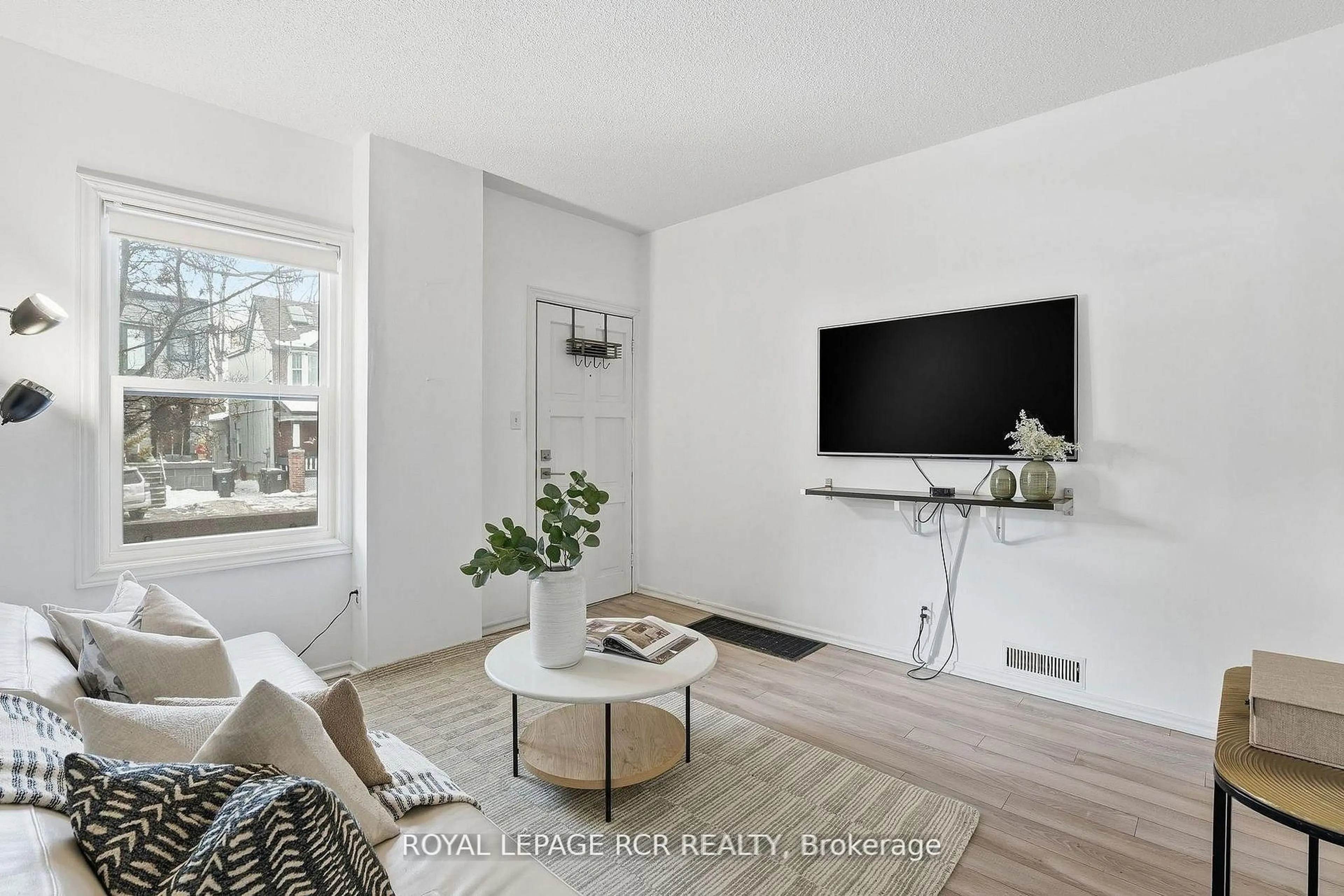 Living room with furniture, unknown for 257 Rhodes Ave, Toronto Ontario M4L 3A2