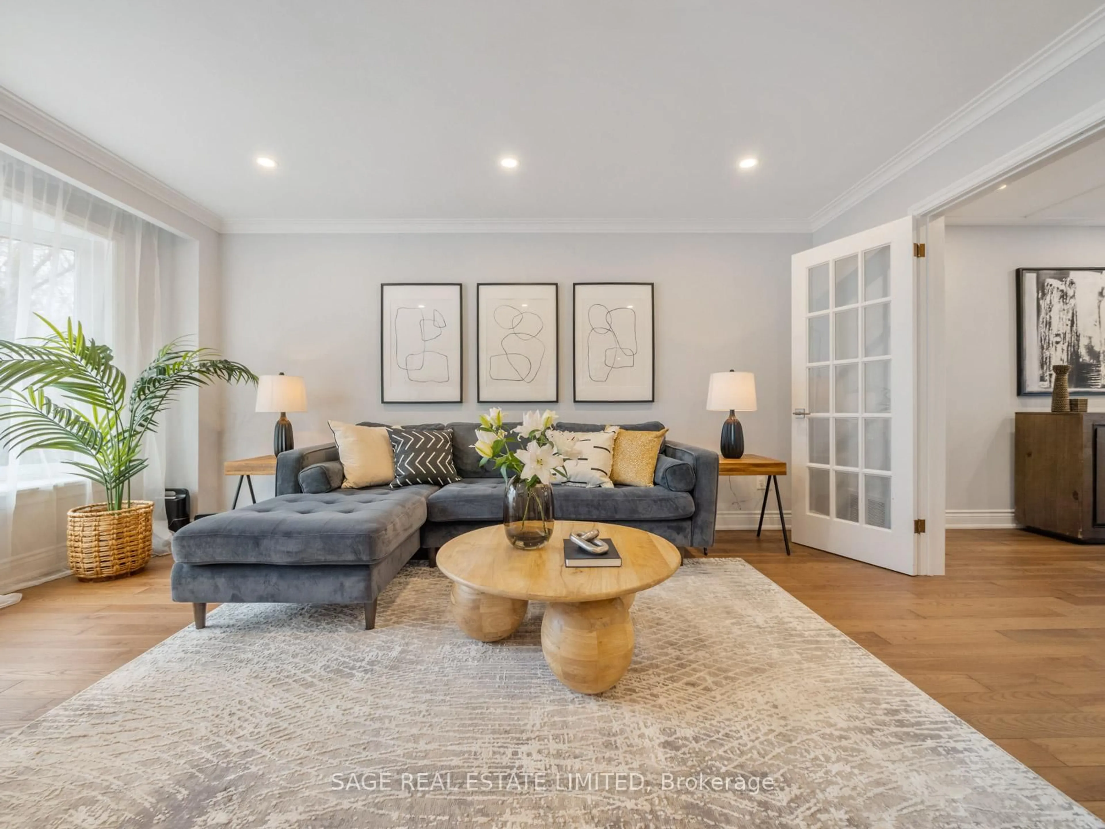 Living room with furniture, wood/laminate floor for 32 Dunwatson Dr, Toronto Ontario M1C 3M2