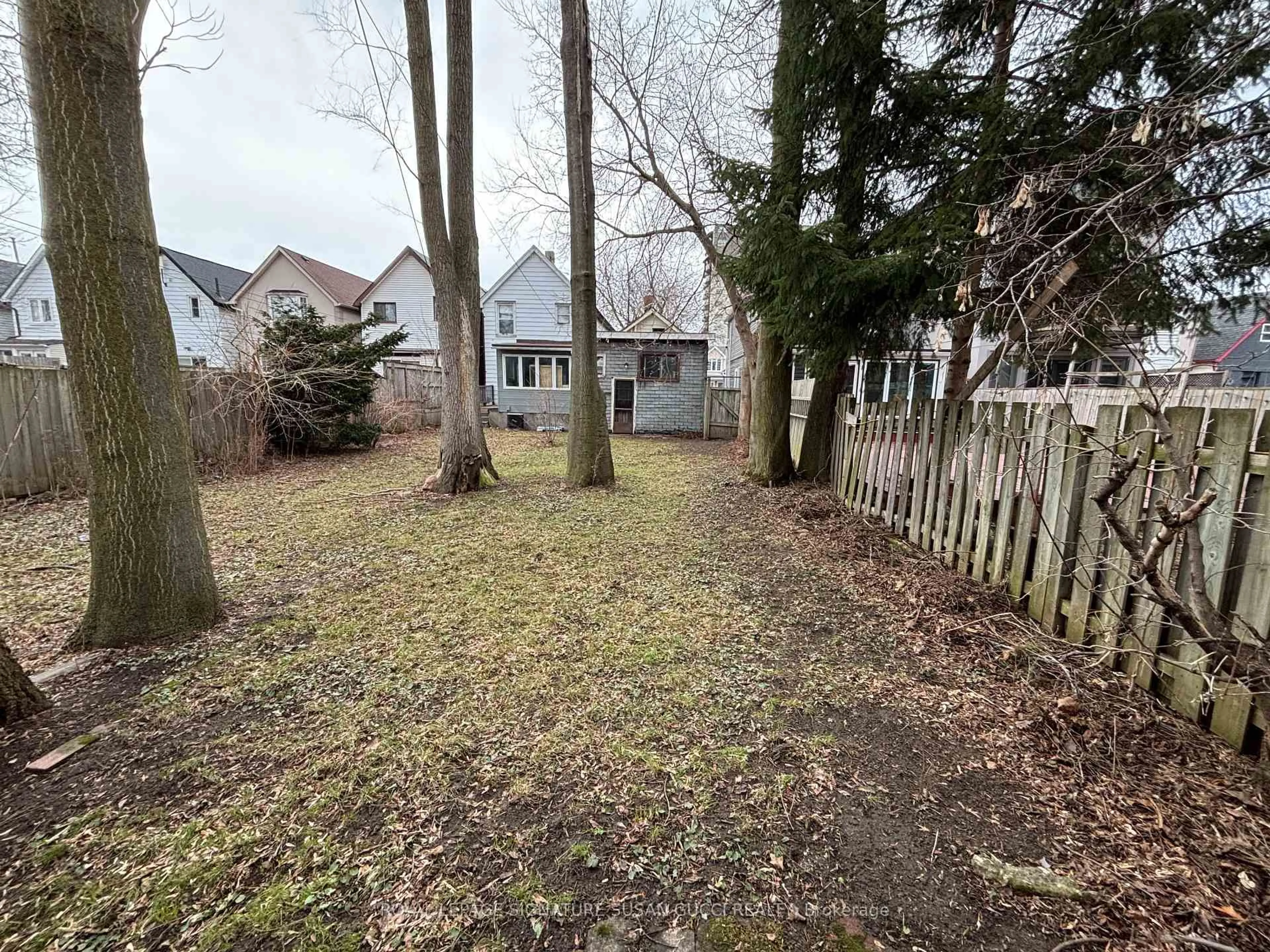 A pic from outside/outdoor area/front of a property/back of a property/a pic from drone, forest/trees view for 215 Gowan Ave, Toronto Ontario M4J 2K7