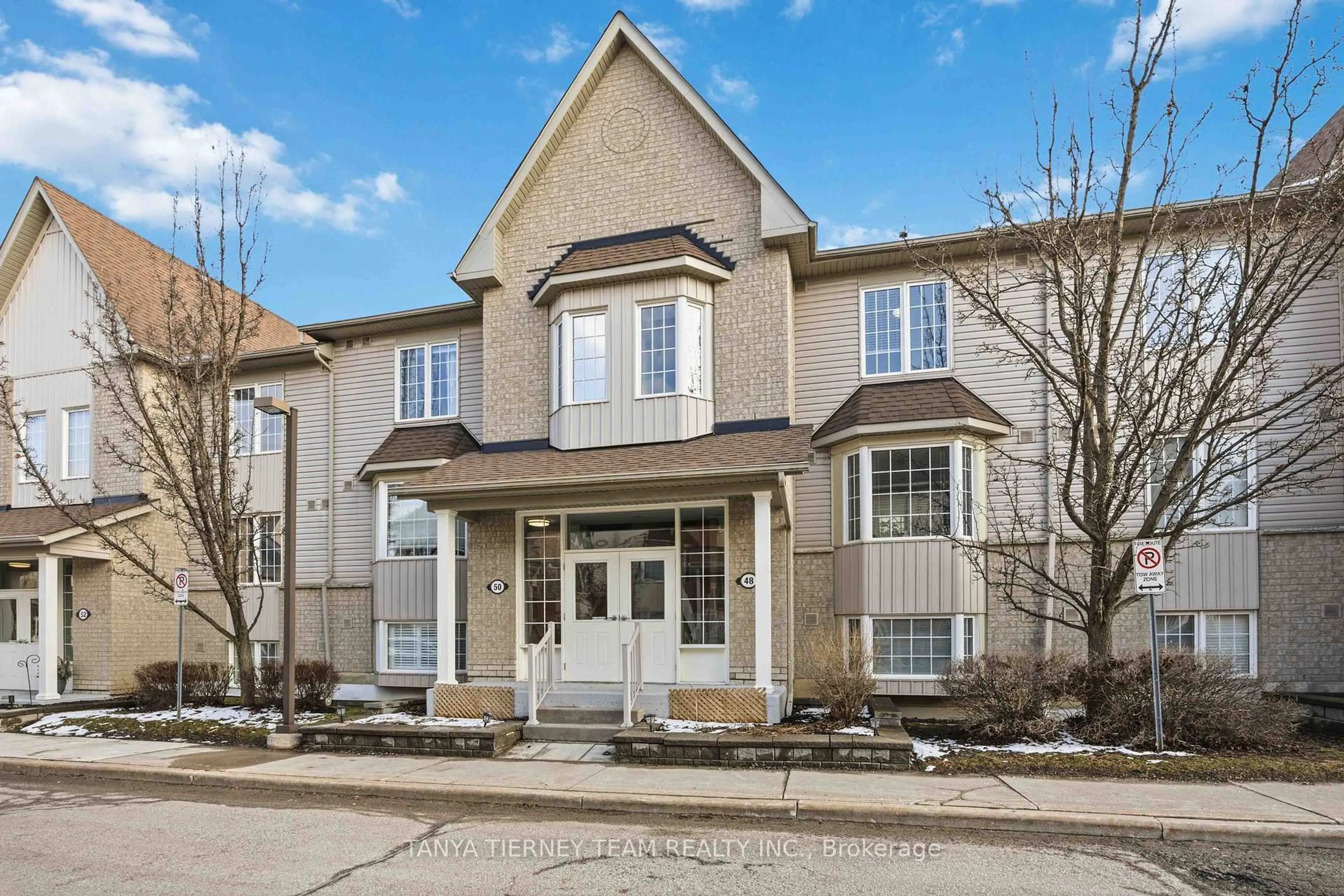 Home with brick exterior material, street for 48 Petra Way #3, Whitby Ontario L1R 0A4