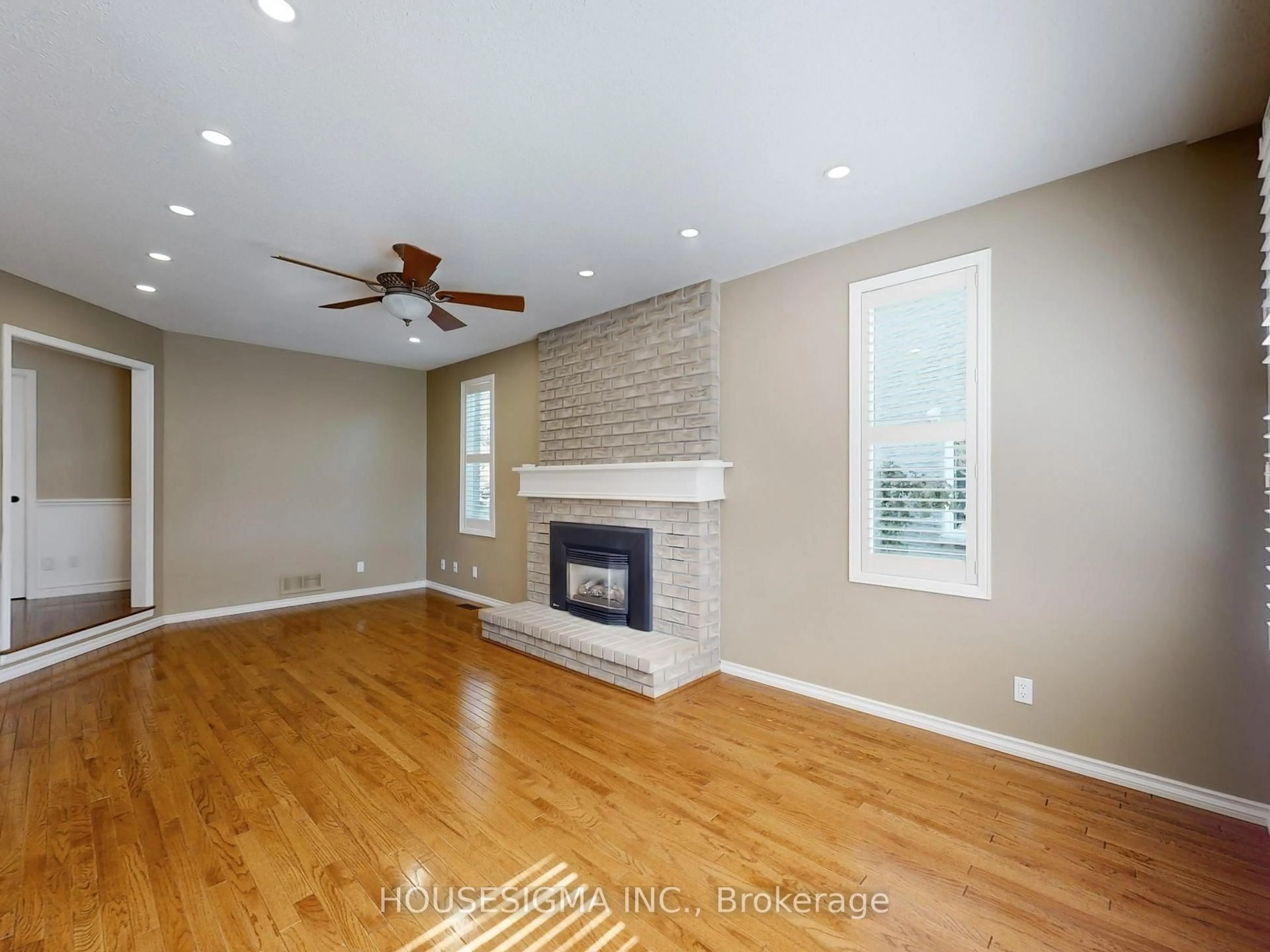 Living room with furniture, wood/laminate floor for 952 Peggoty Circ, Oshawa Ontario L1K 2G5