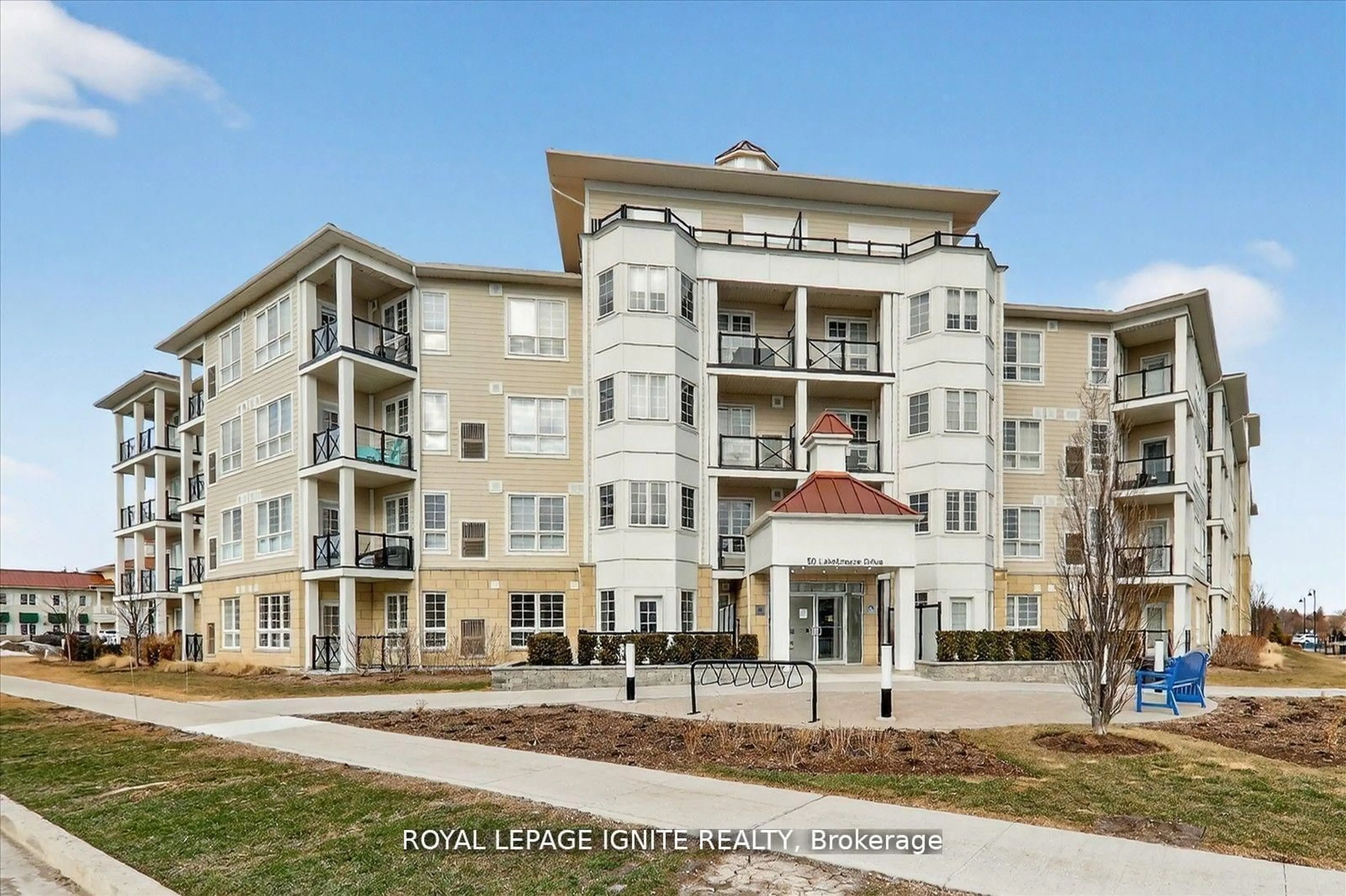 A pic from outside/outdoor area/front of a property/back of a property/a pic from drone, water/lake/river/ocean view for 50 Lakebreeze Dr #323, Clarington Ontario L1B 0V9