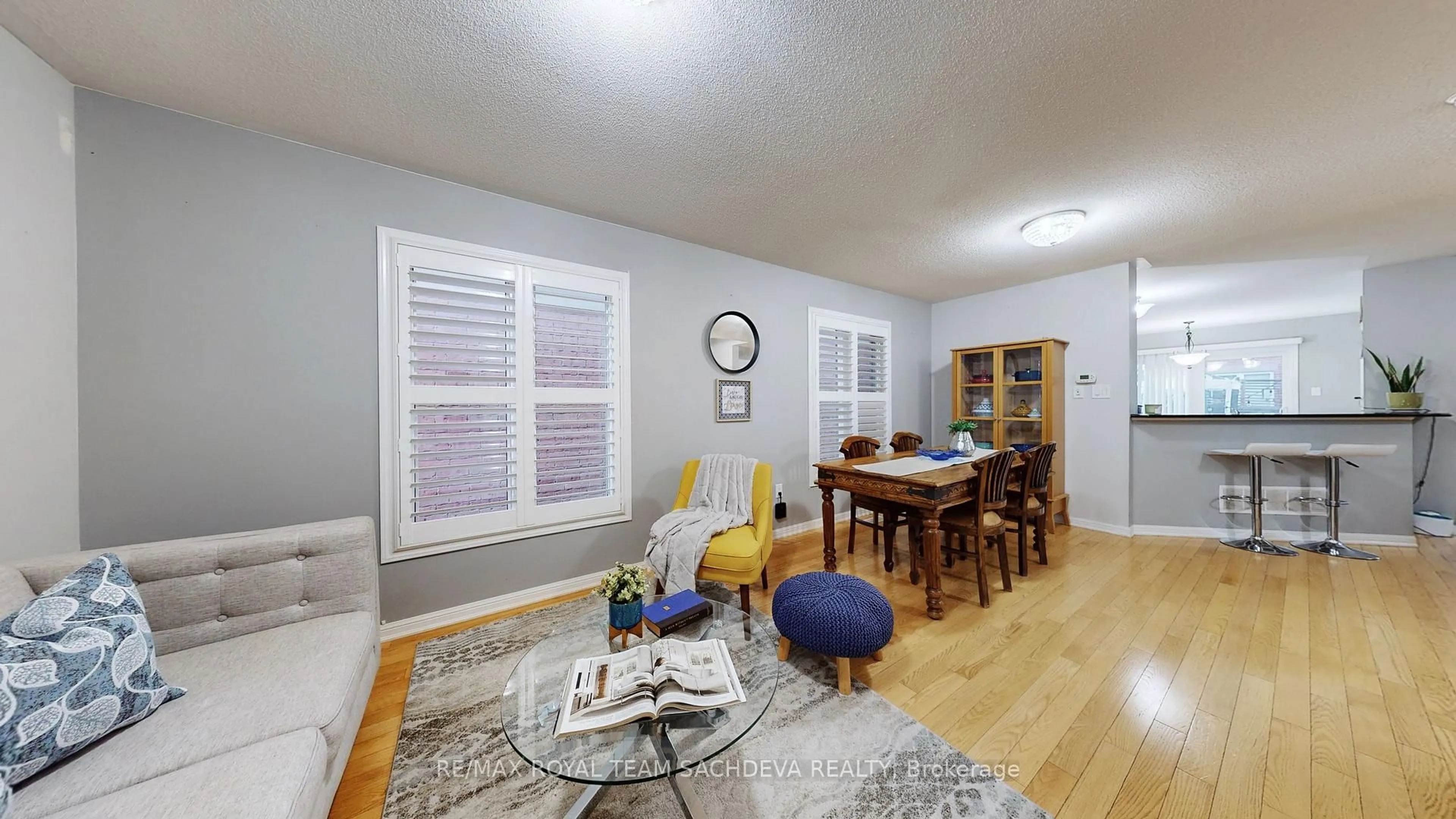 Living room with furniture, wood/laminate floor for 1809 Parkhurst Cres, Pickering Ontario L1X 0A8