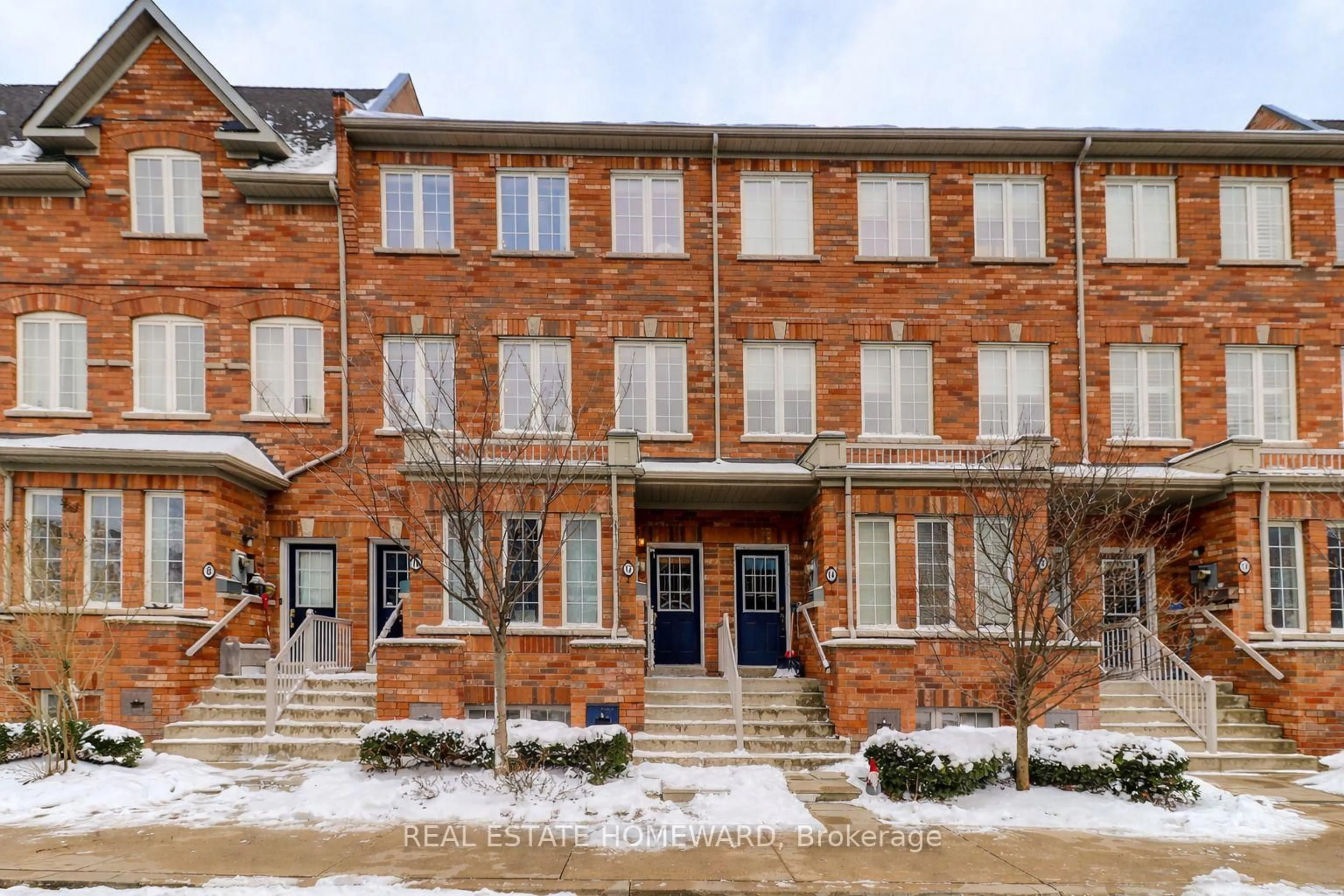 Home with brick exterior material, street for 12 Carnahan Terr, Toronto Ontario M4E 0B2