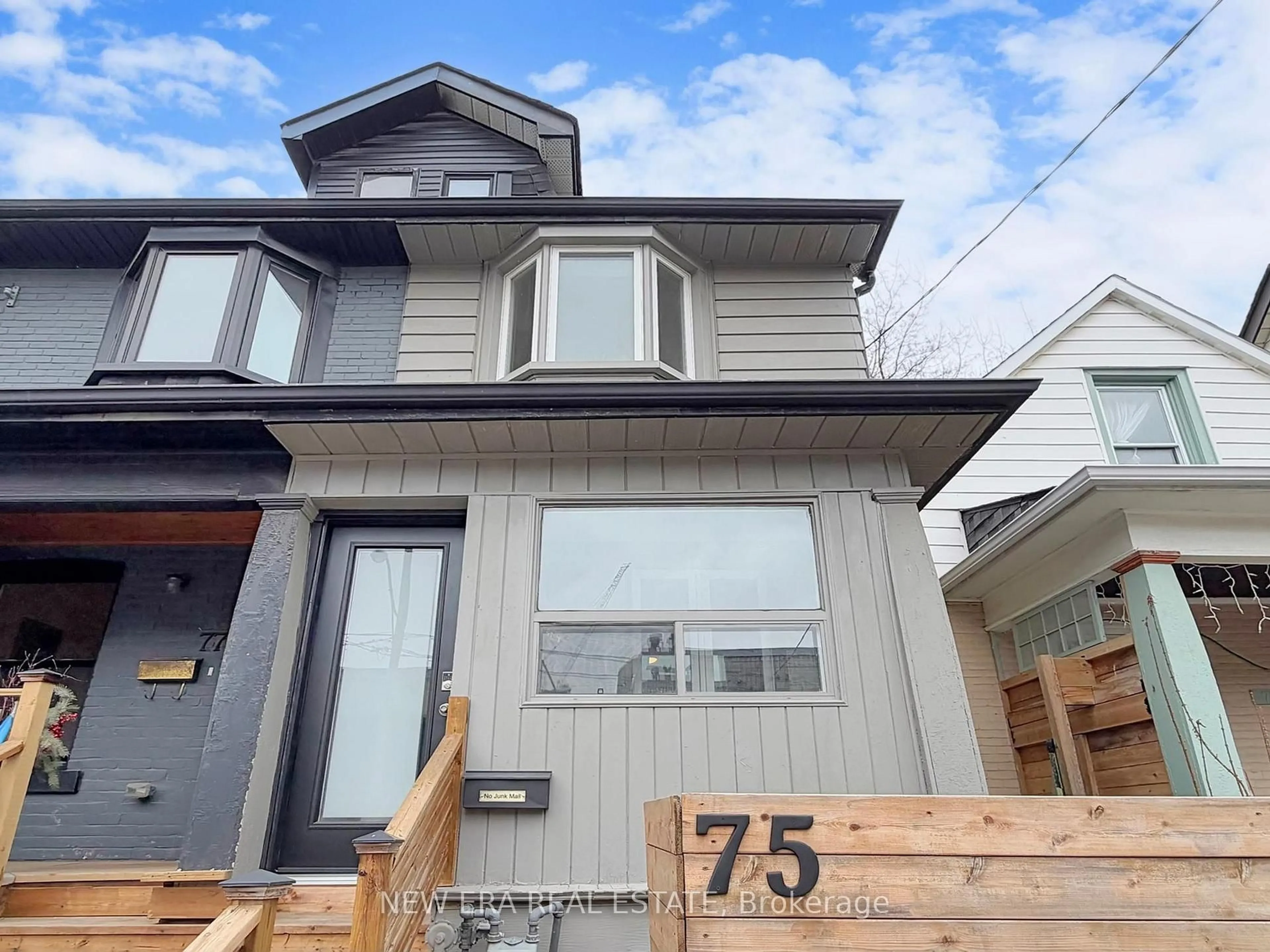 Home with vinyl exterior material, street for 75 Laing St, Toronto Ontario M4L 2N4