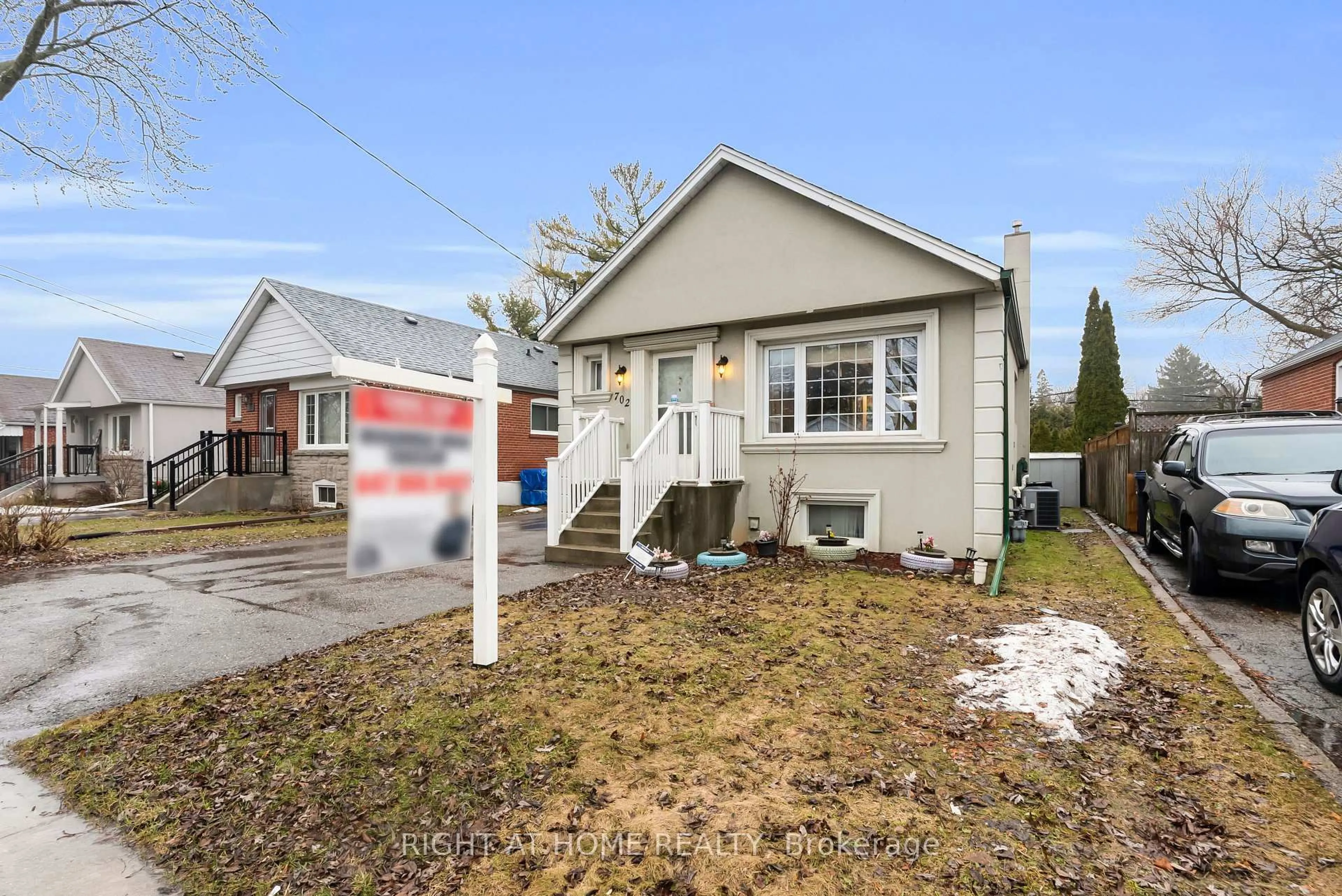 Home with vinyl exterior material, street for 702 Pharmacy Ave, Toronto Ontario M1L 3J2