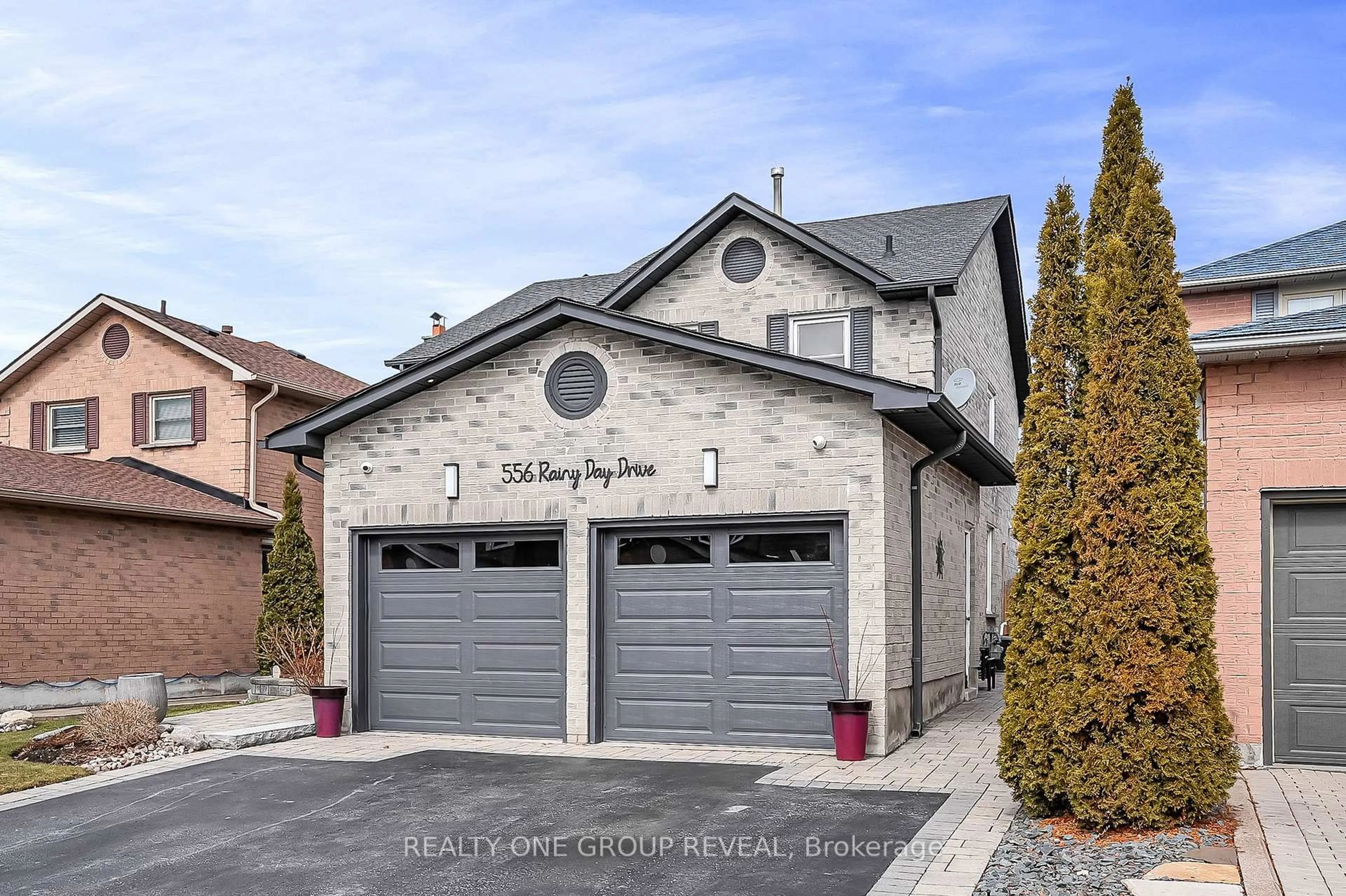 Home with brick exterior material, street for 556 Rainy Day Dr, Pickering Ontario L1V 5Z9