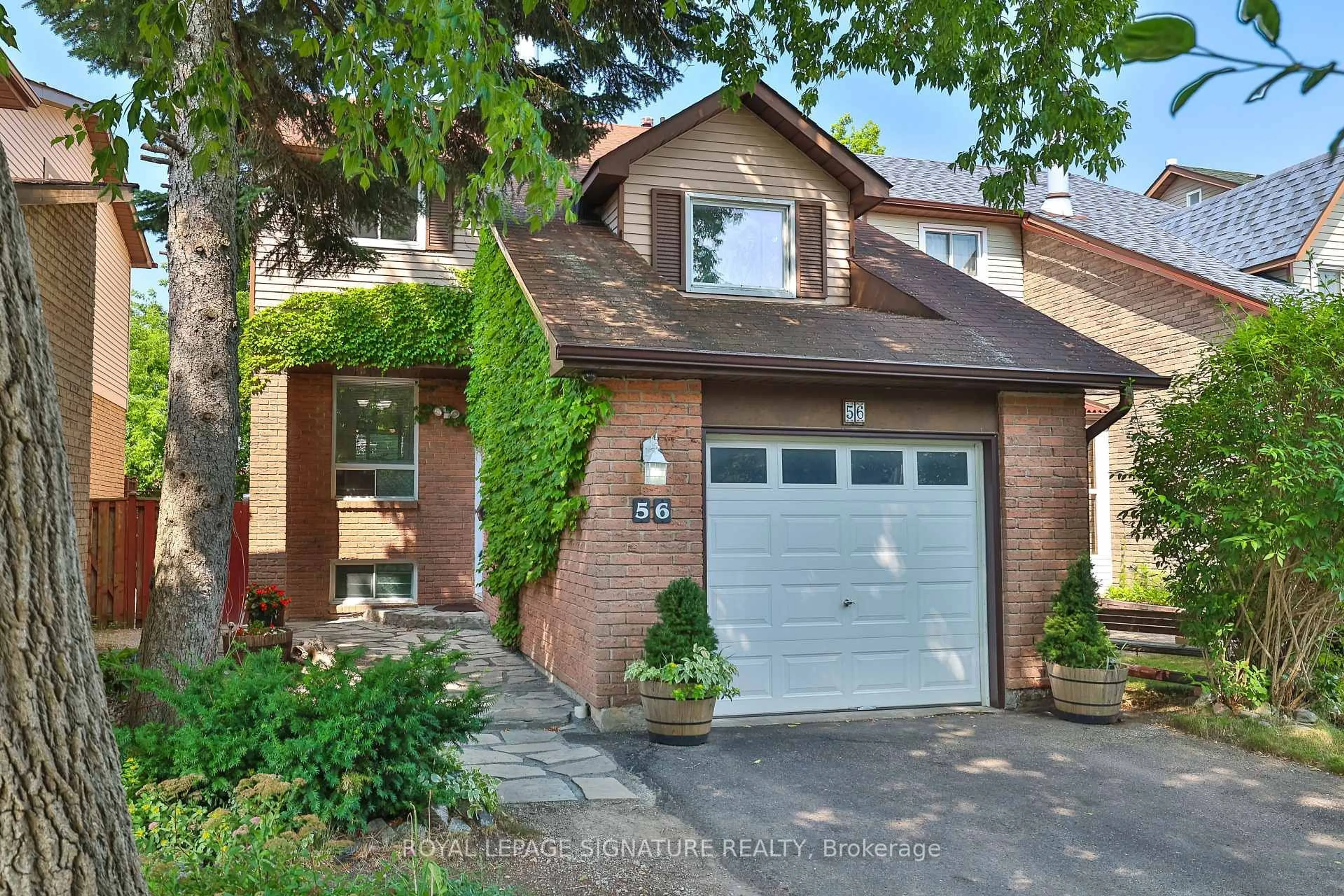 Home with brick exterior material, street for 56 Muirlands Dr, Toronto Ontario M1V 2B4