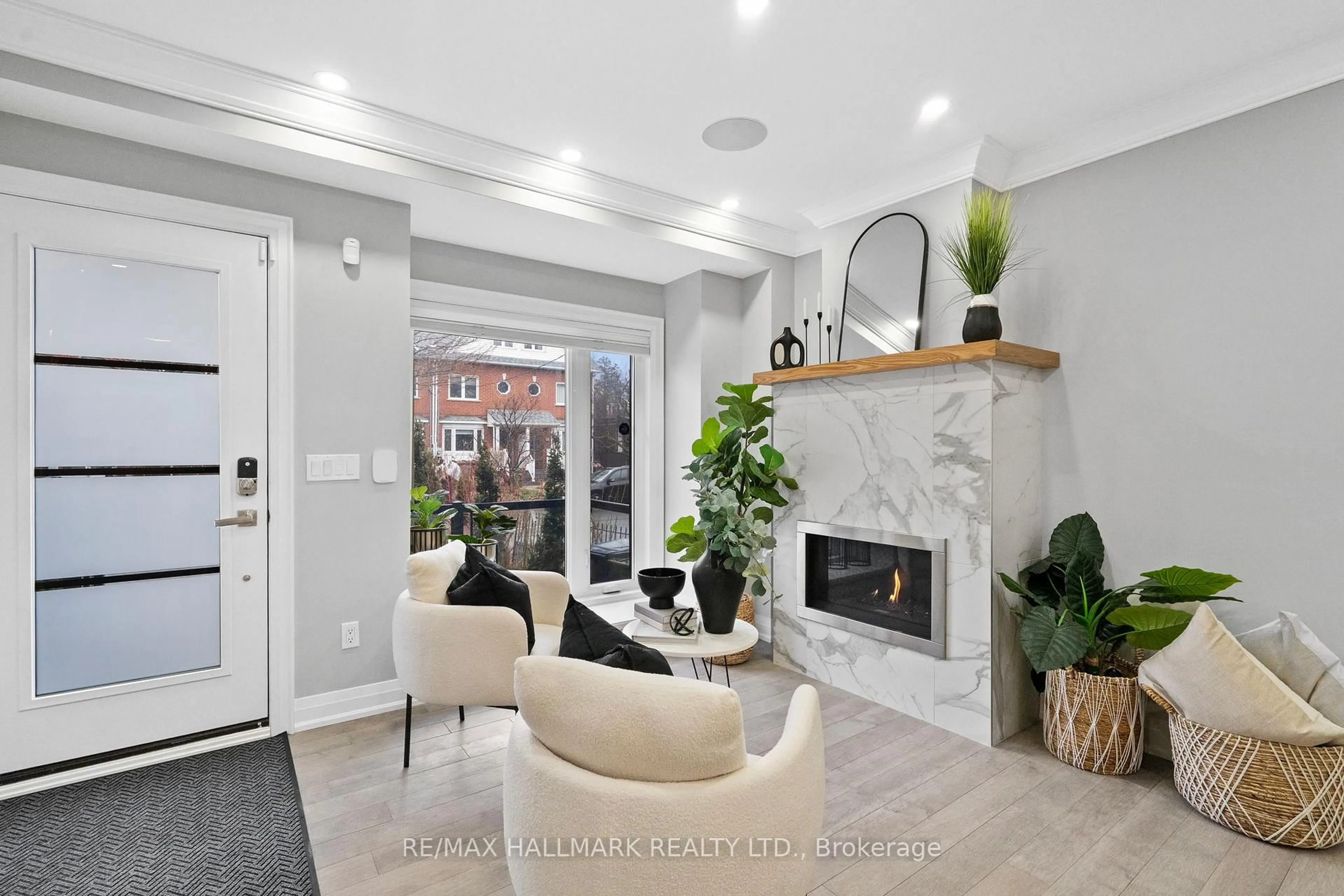 Living room with furniture, ceramic/tile floor for 394 Main St, Toronto Ontario M4C 4X8