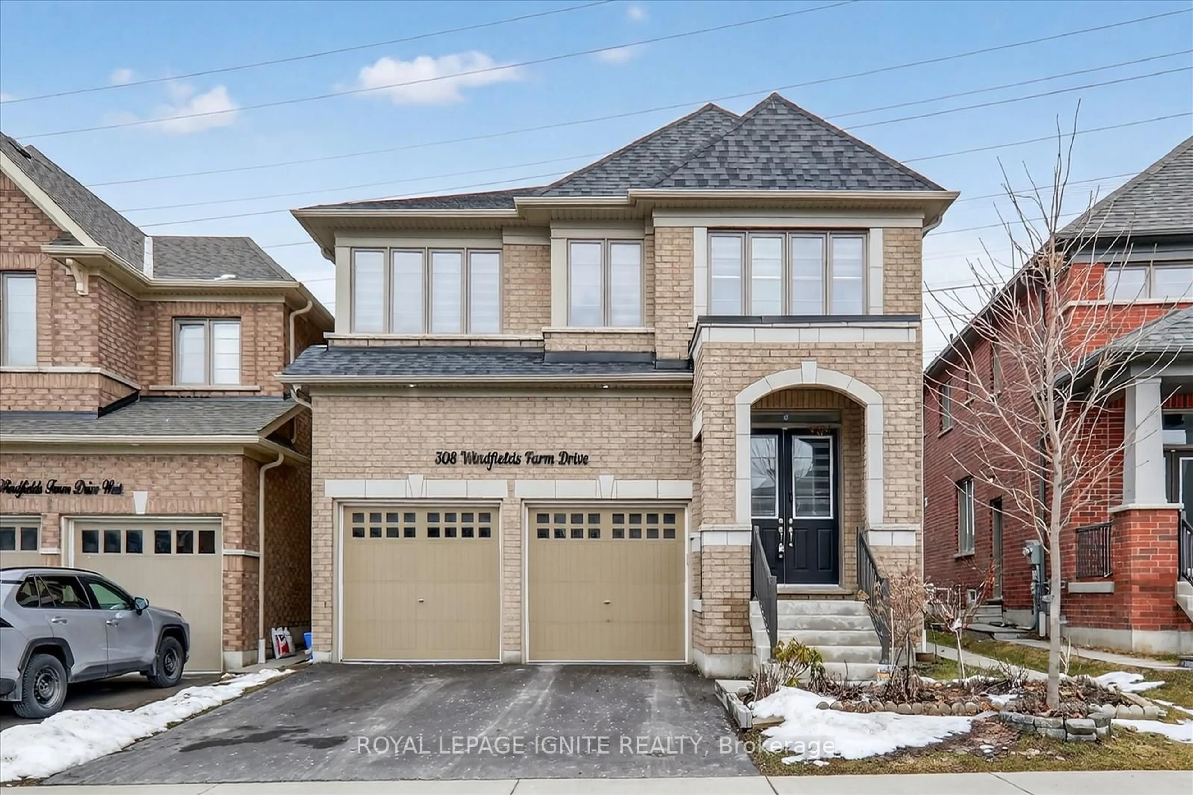 Home with brick exterior material, street for 308 Windfields Farm Dr, Oshawa Ontario L1L 0M3