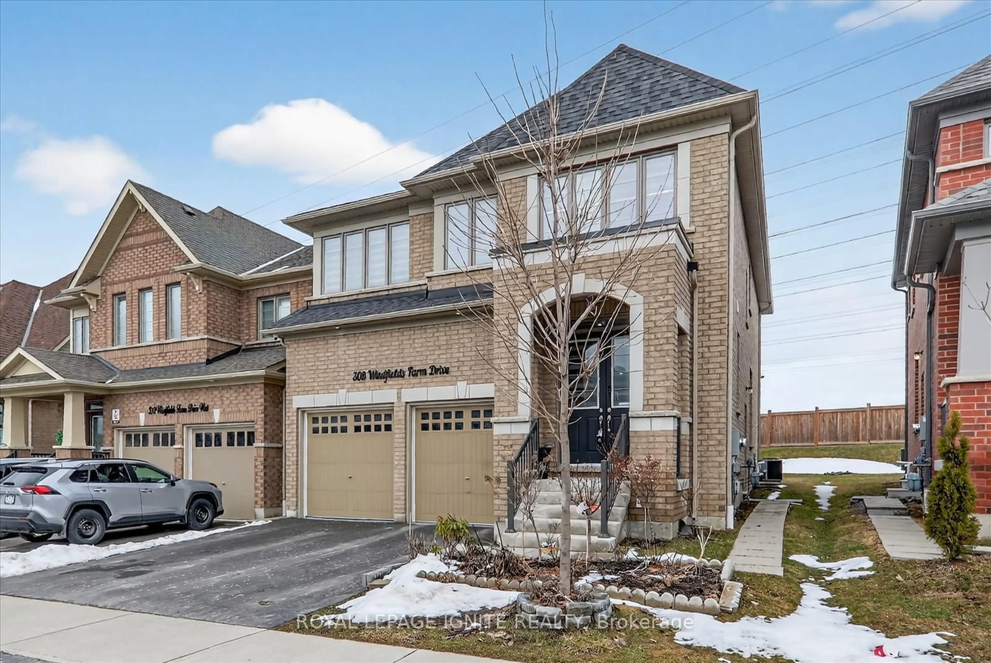 Home with brick exterior material, street for 308 Windfields Farm Dr, Oshawa Ontario L1L 0M3