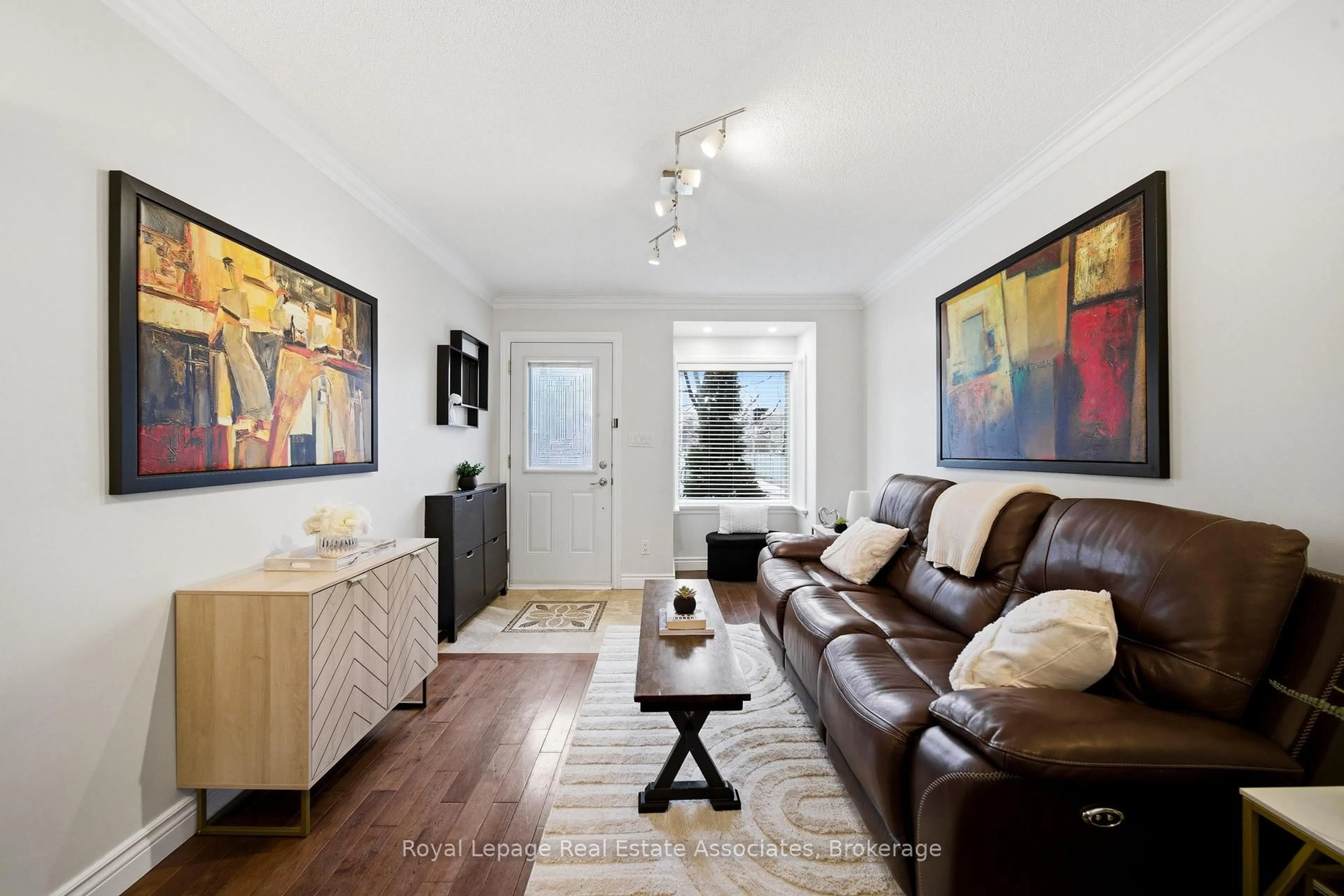 Living room with furniture, wood/laminate floor for 177 CHISHOLM Ave, Toronto Ontario M4C 4V9