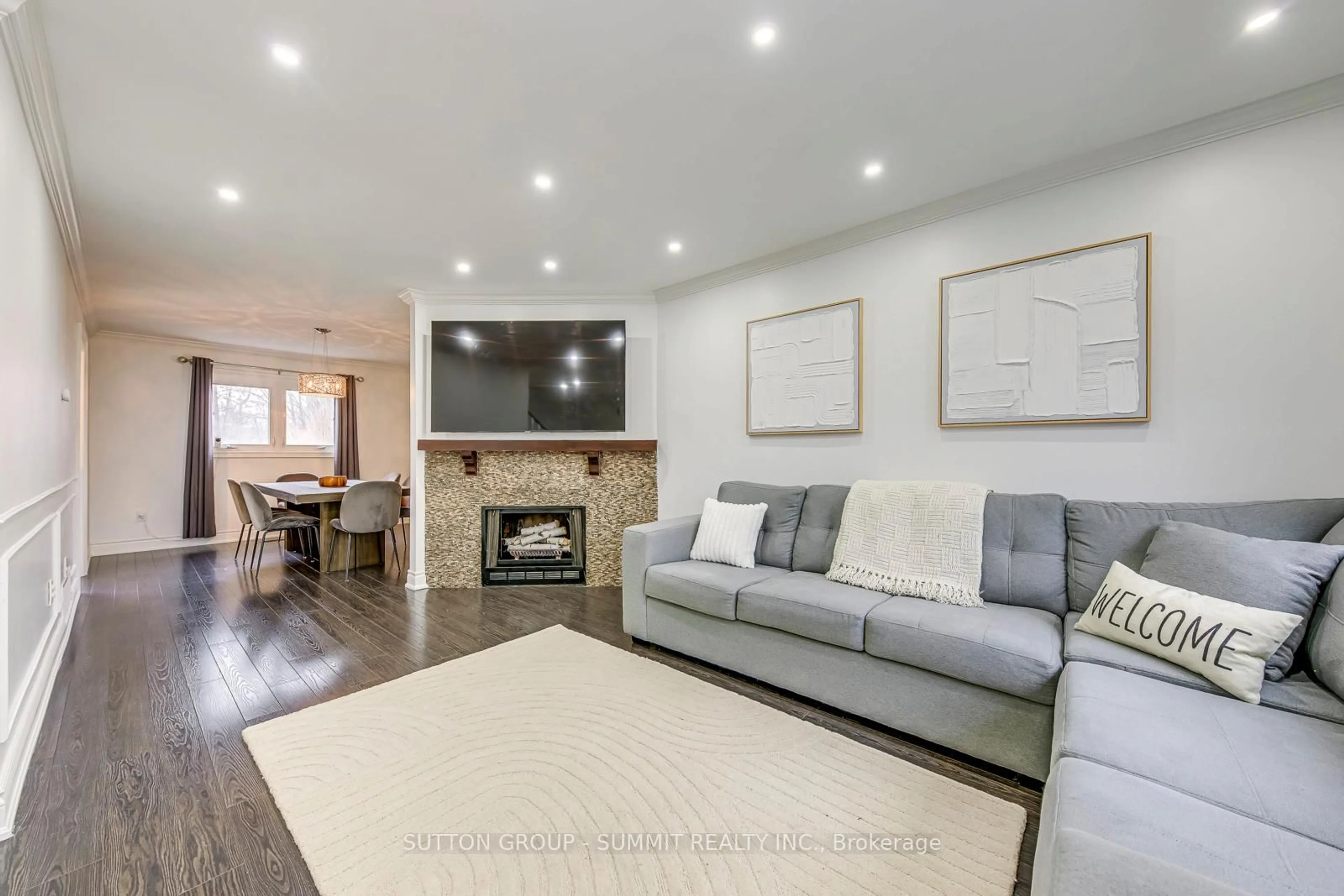 Living room with furniture, wood/laminate floor for 46 Frazer Rd, Ajax Ontario L1S 4B2