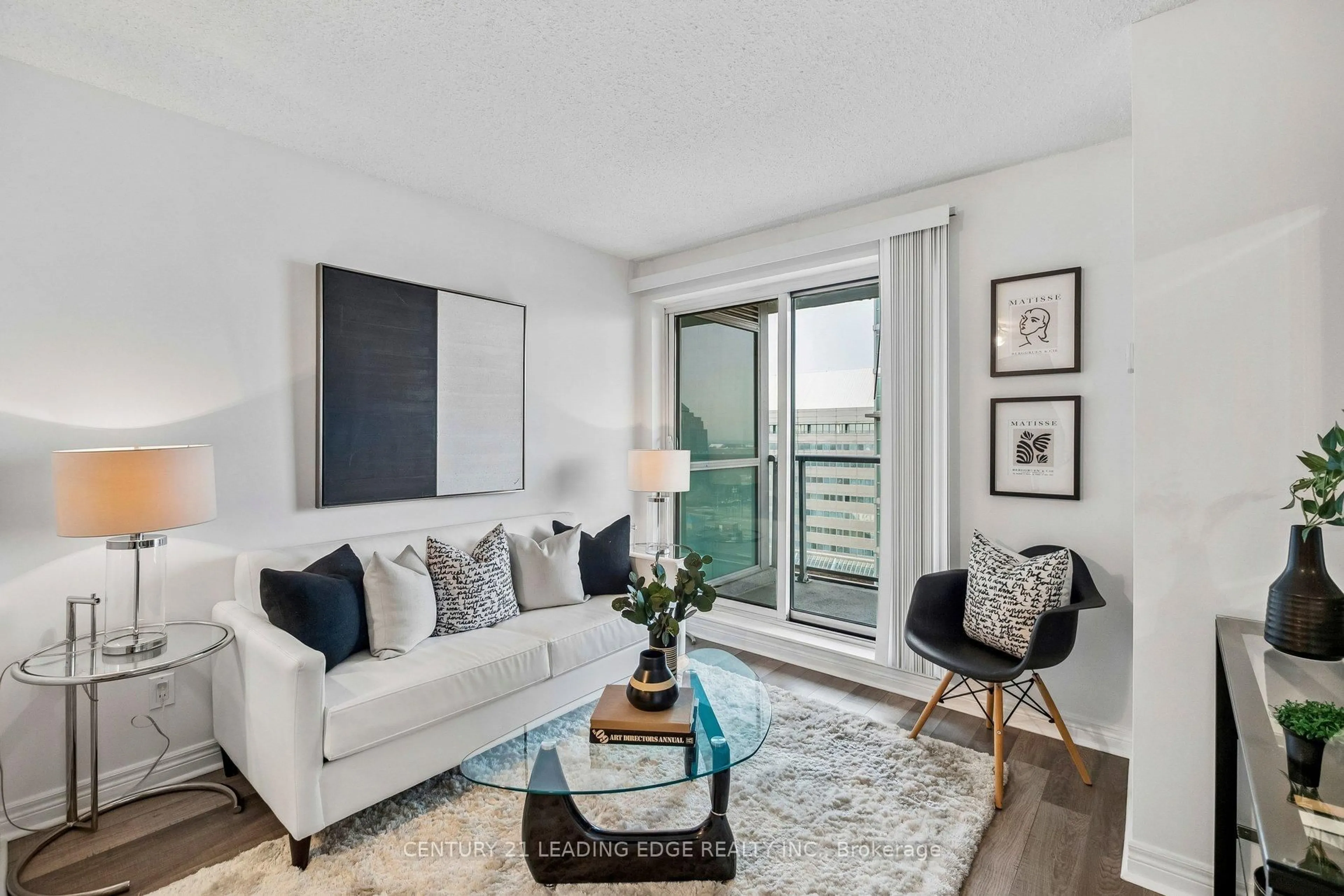 Living room with furniture, wood/laminate floor for 50 Town Centre Crt #1506, Toronto Ontario M1P 0A9