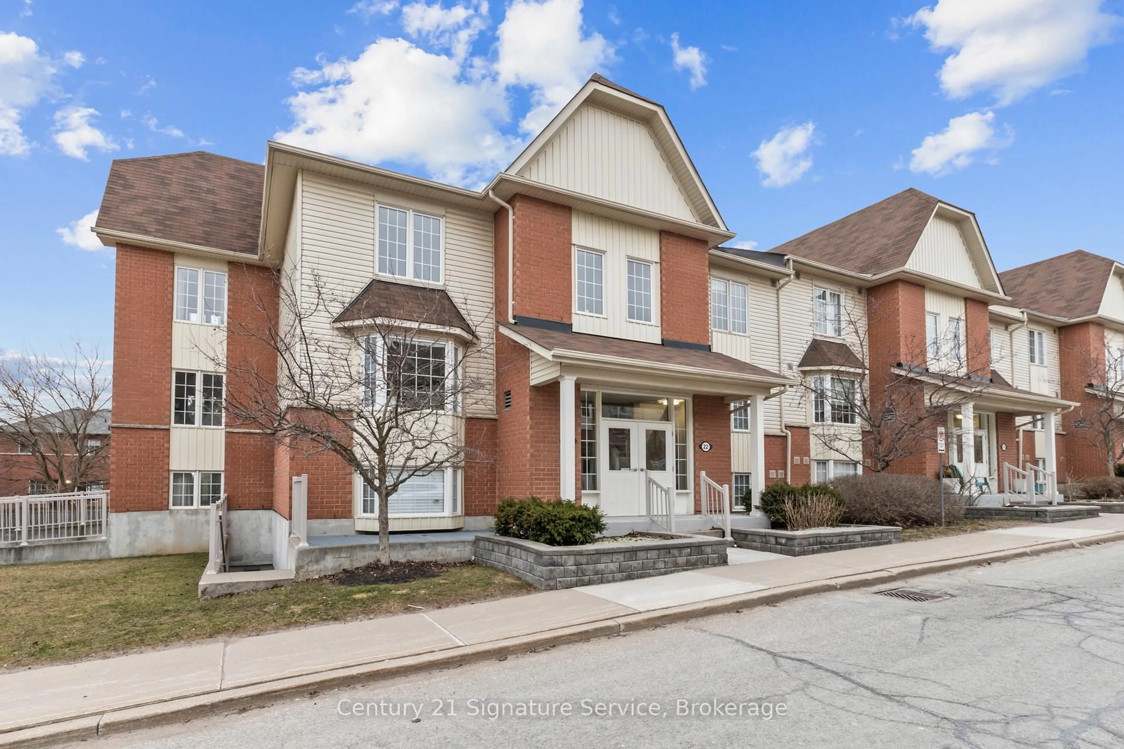Home with brick exterior material, street for 24 Petra Way #1, Whitby Ontario L1R 0A5