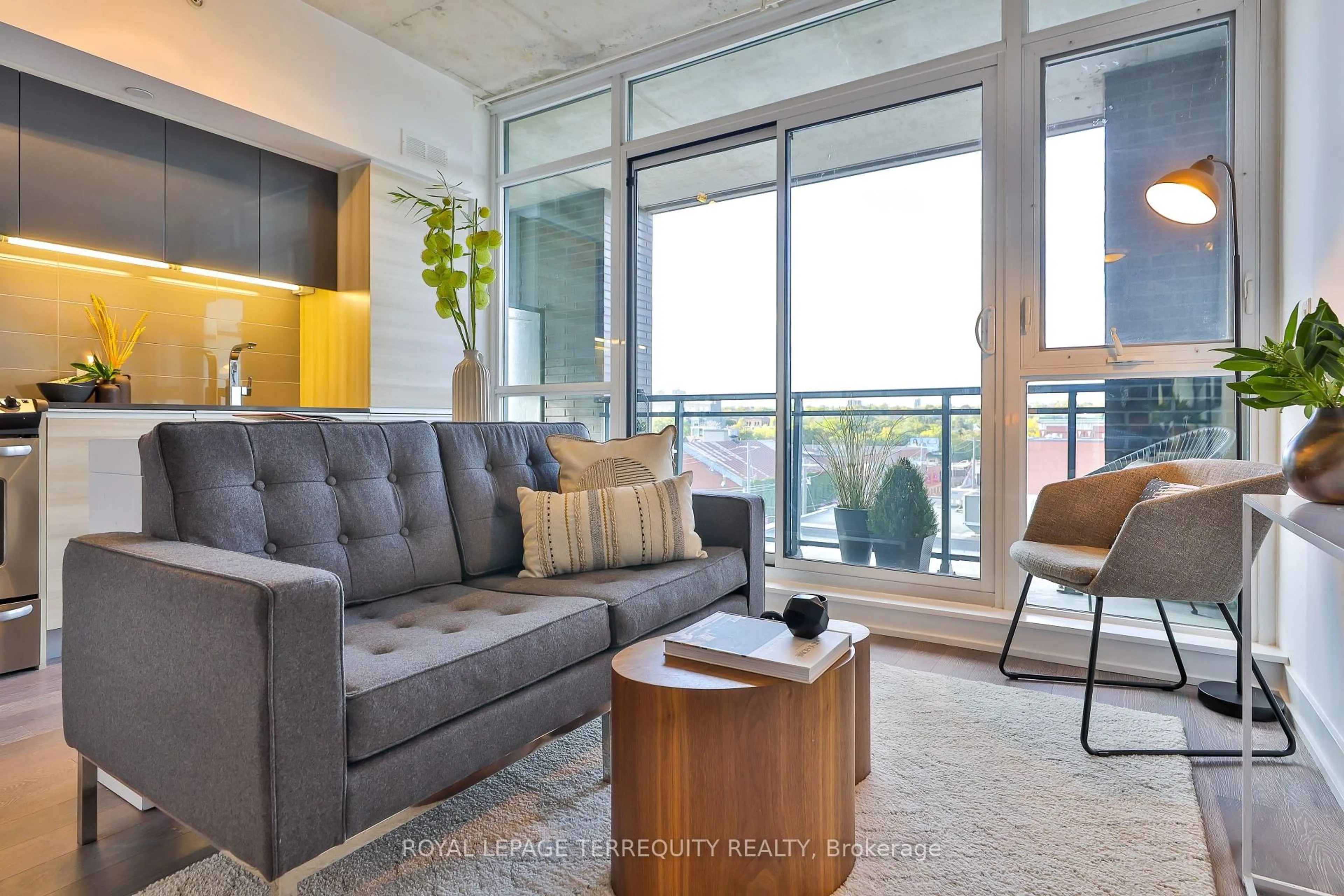 Living room with furniture, cement floor for 1190 Dundas St #625, Toronto Ontario M4M 0C5