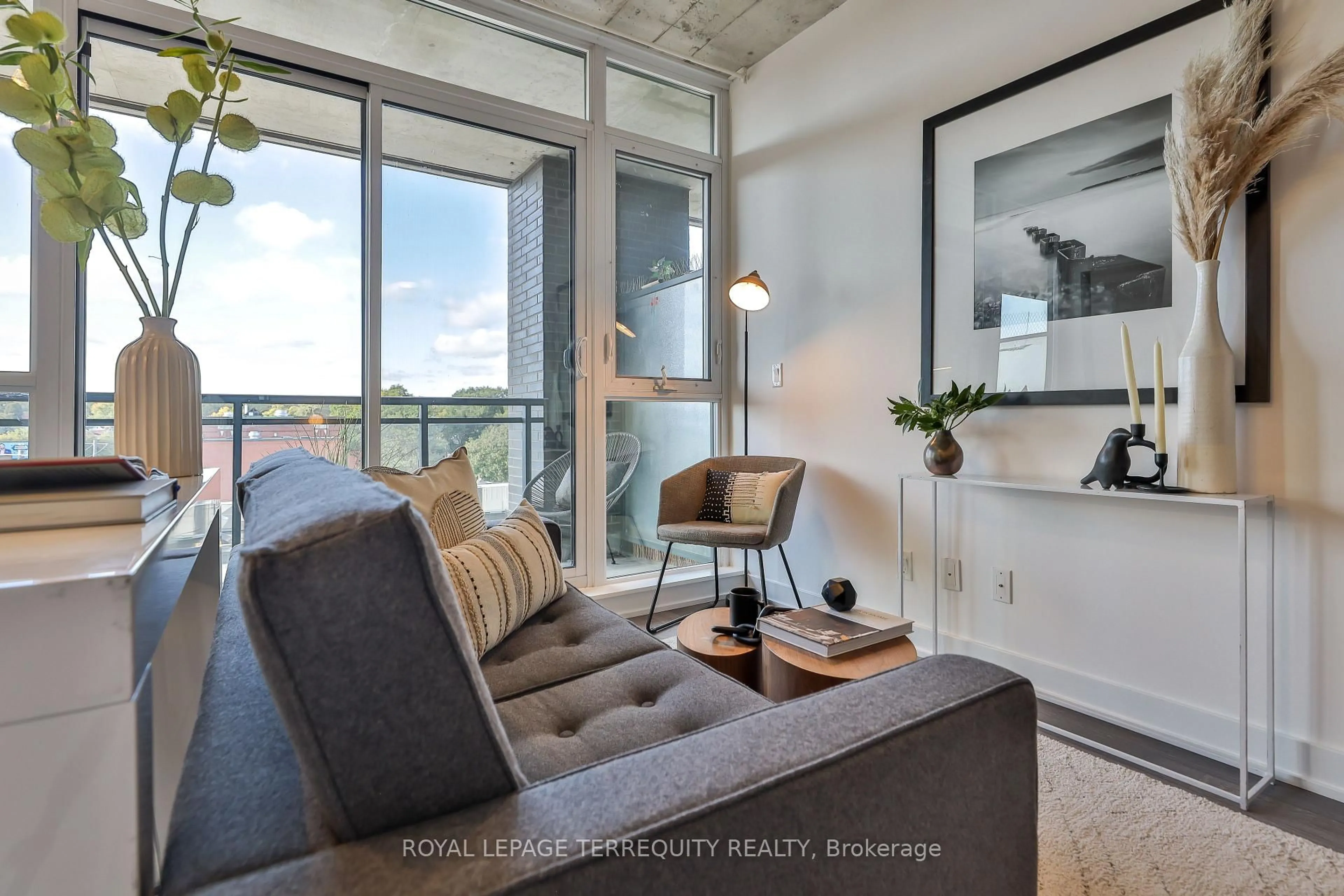 Living room with furniture, cement floor for 1190 Dundas St #625, Toronto Ontario M4M 0C5