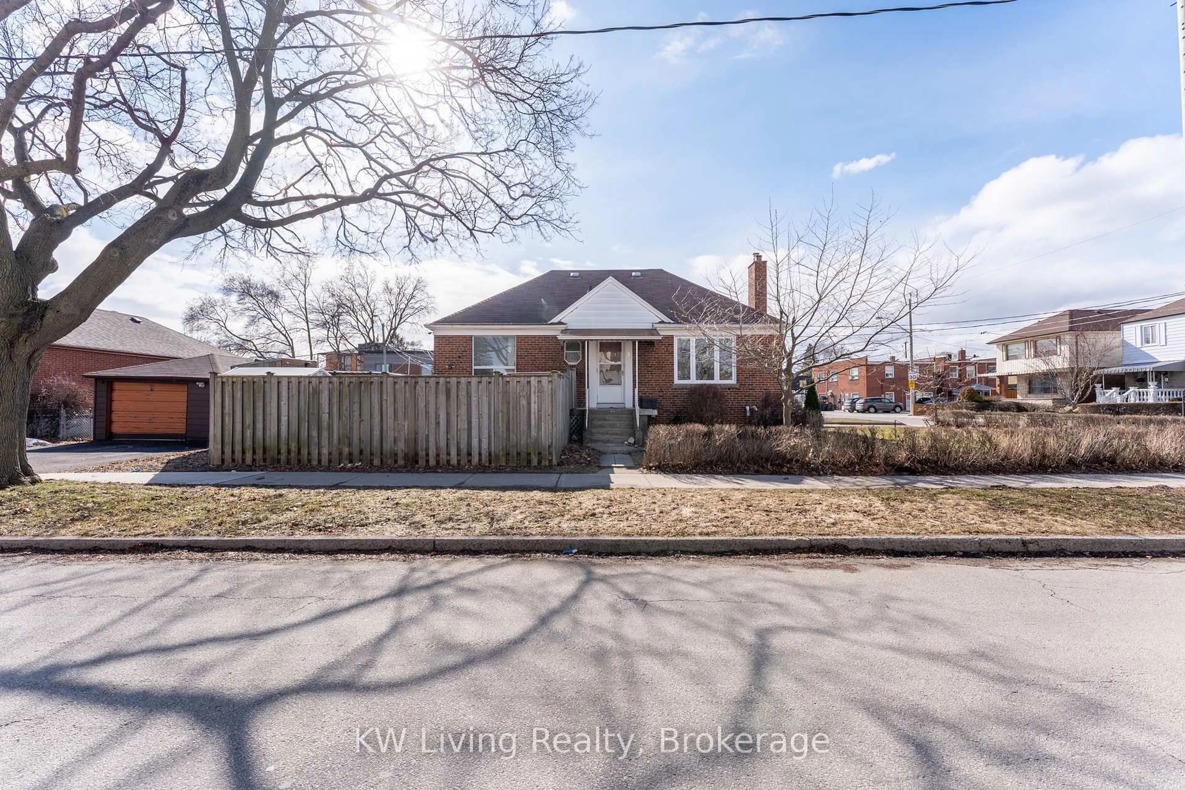 Home with brick exterior material, street for 5 Plains Rd, Toronto Ontario M4J 2P7