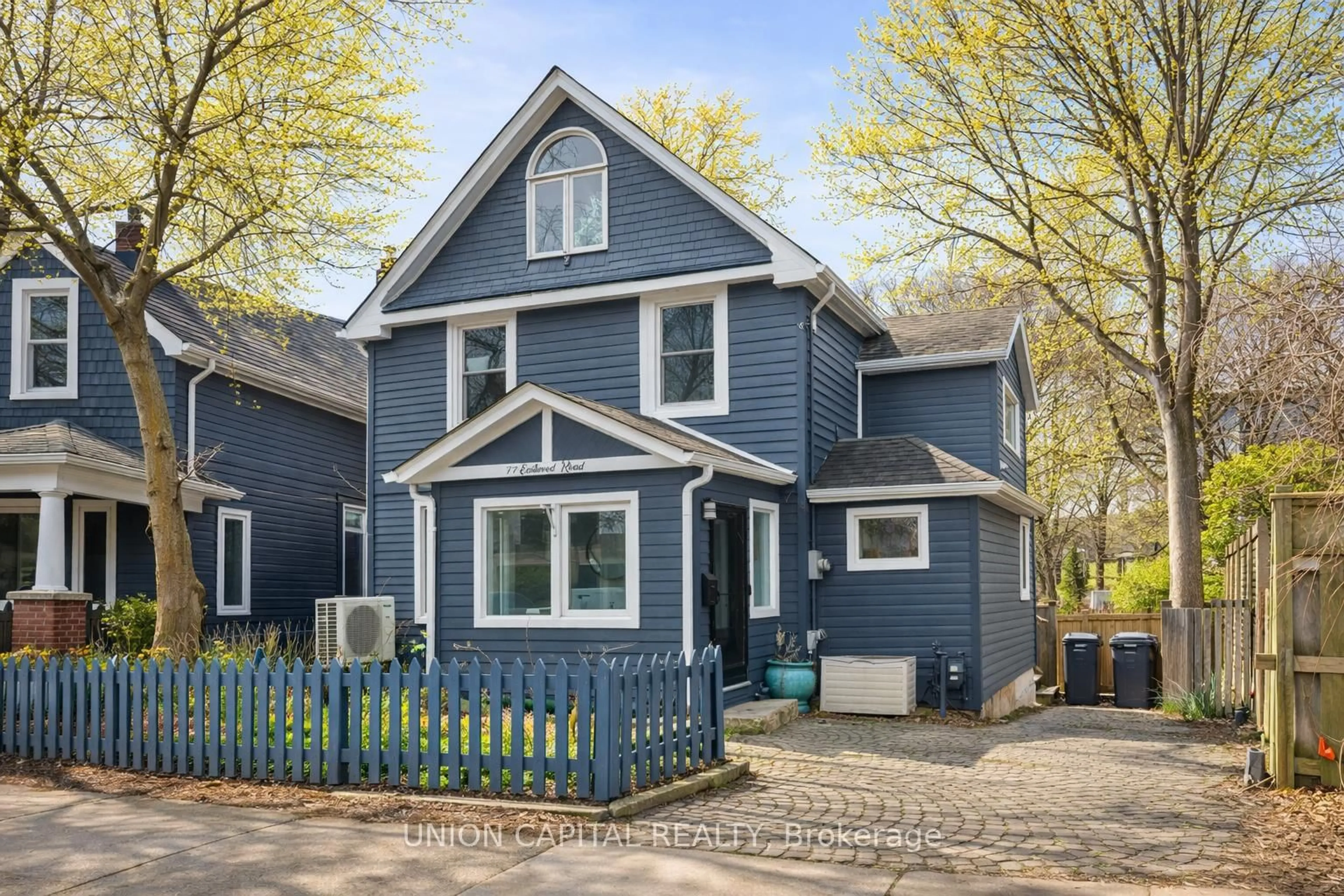 Home with vinyl exterior material, street for 77 Eastwood Rd, Toronto Ontario M4L 2C7