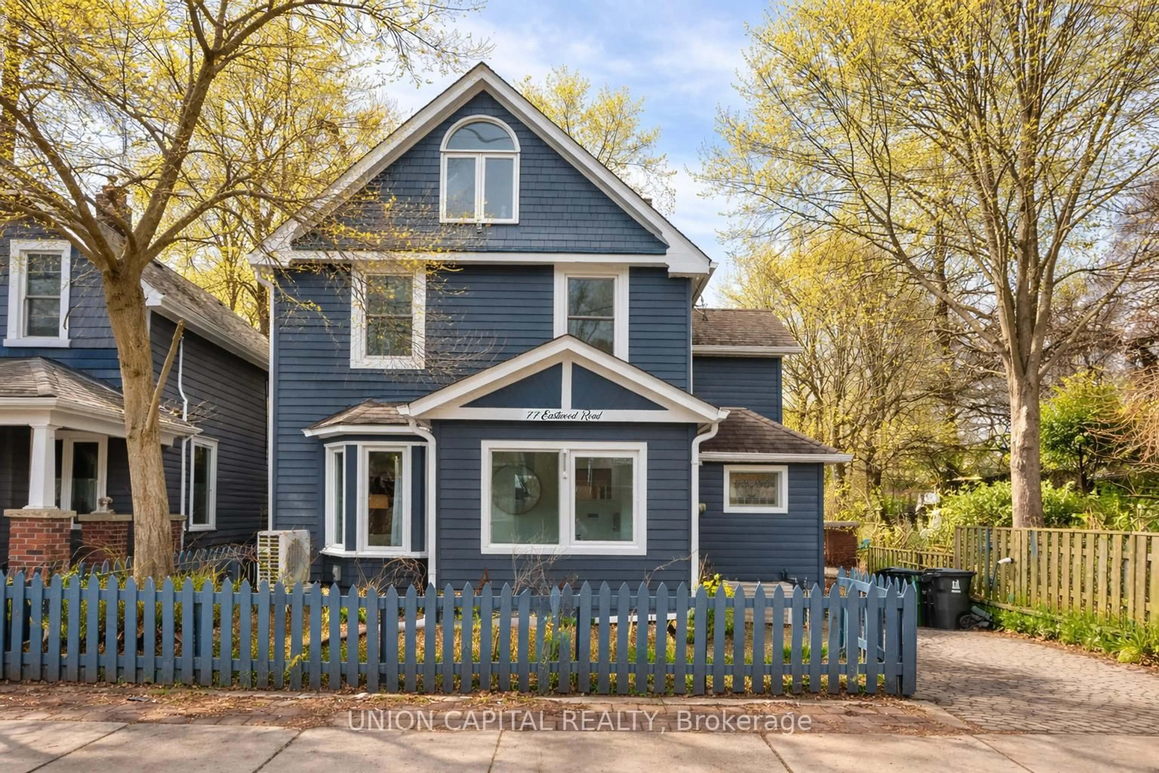 Home with vinyl exterior material, street for 77 Eastwood Rd, Toronto Ontario M4L 2C7