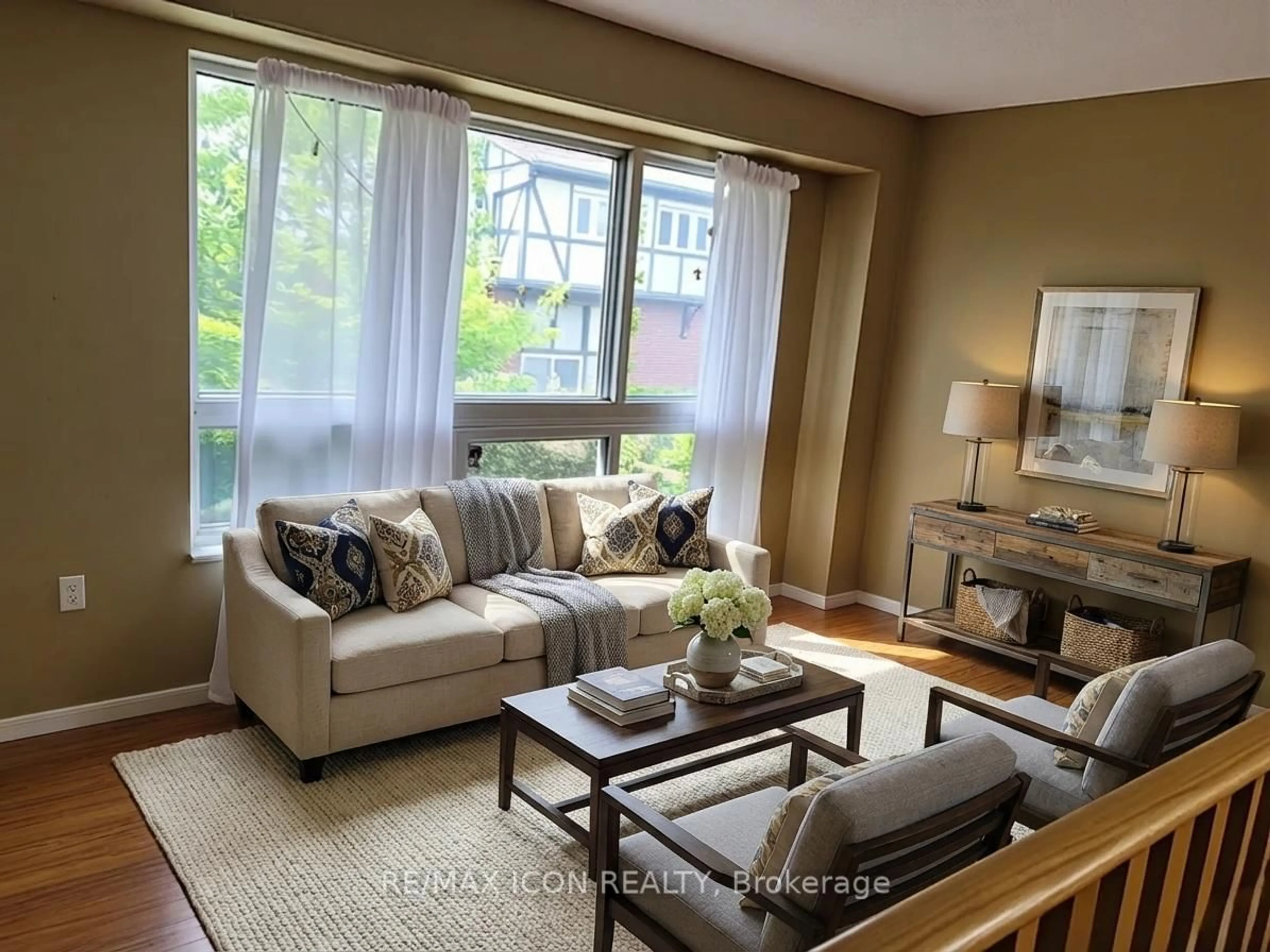 Living room with furniture, wood/laminate floor for 351 Trudelle St, Toronto Ontario M1J 3J9