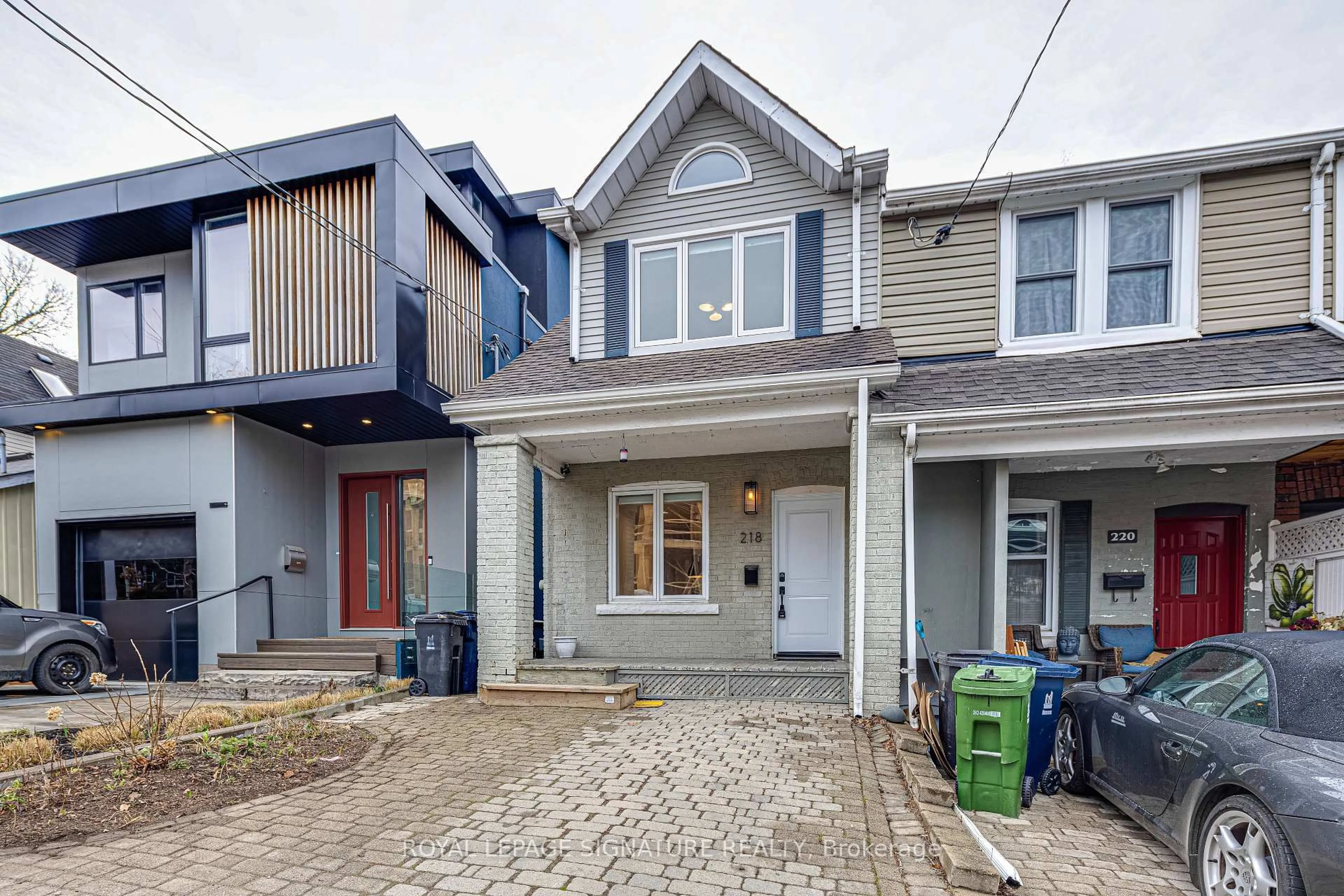 Home with brick exterior material, street for 218 Lee Ave, Toronto Ontario M4E 2P3