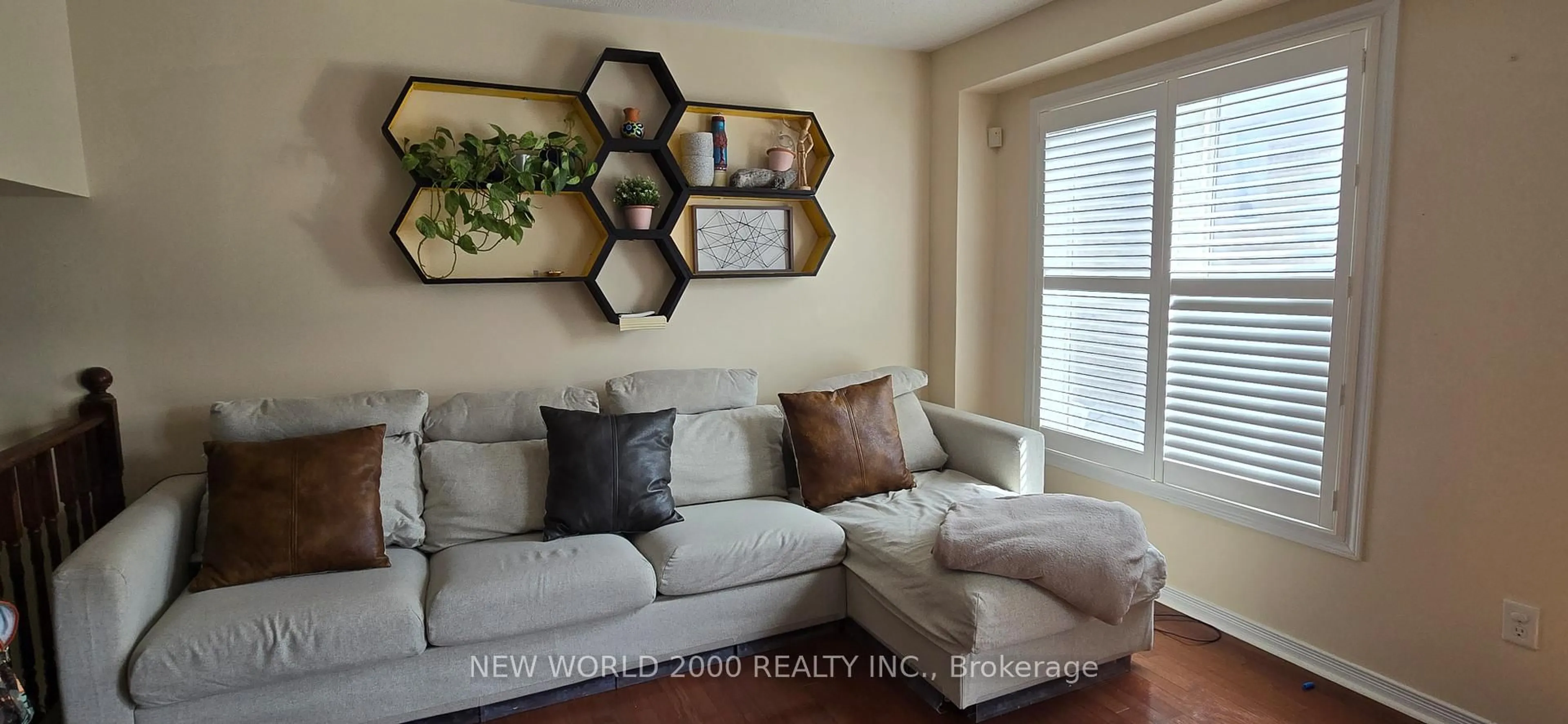 Living room with furniture, wood/laminate floor for 27 Stonewood St, Ajax Ontario L1S 0B3