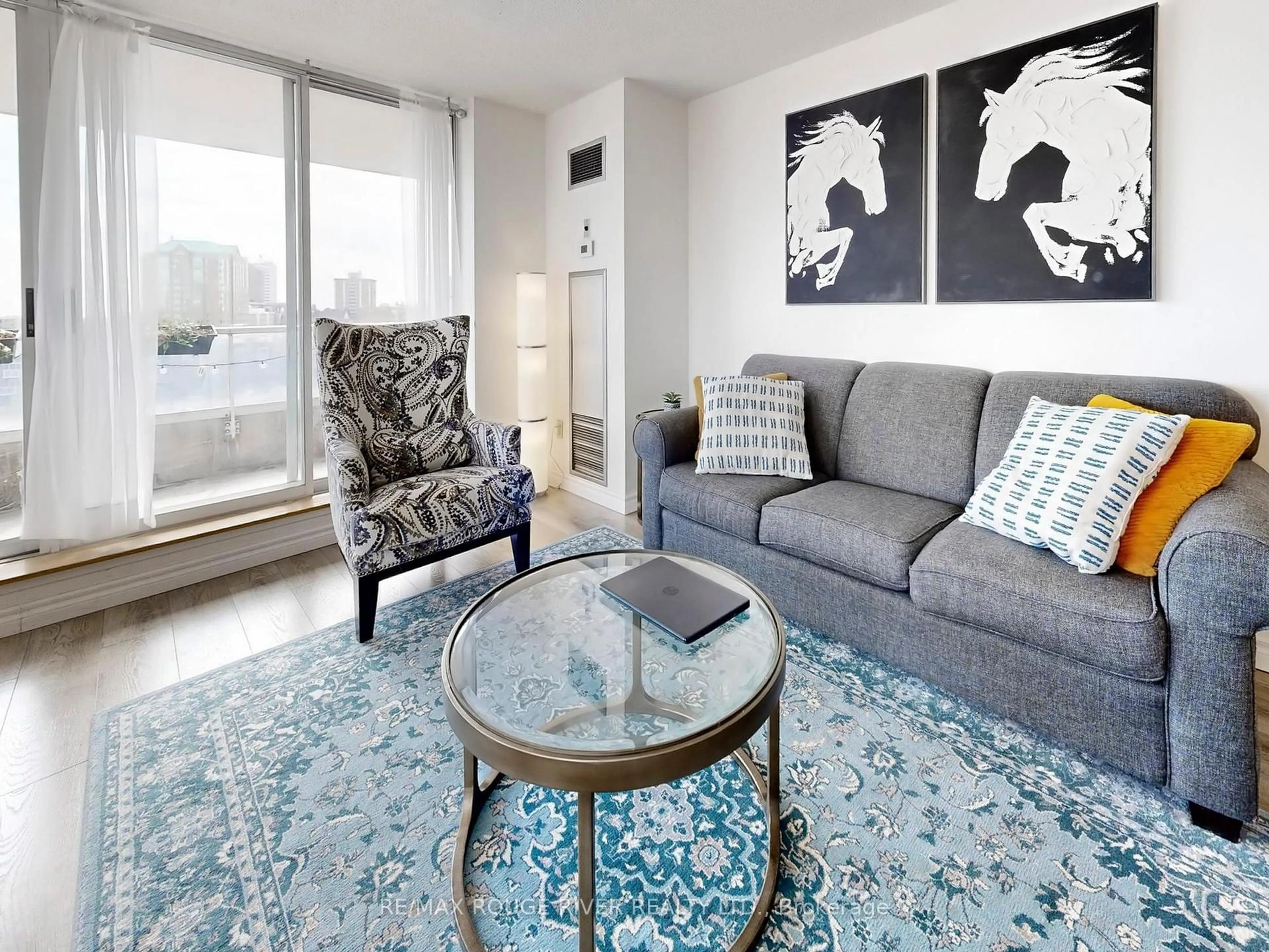 Living room with furniture, carpet floor for 410 McLevin Ave #602, Toronto Ontario M1B 5J5