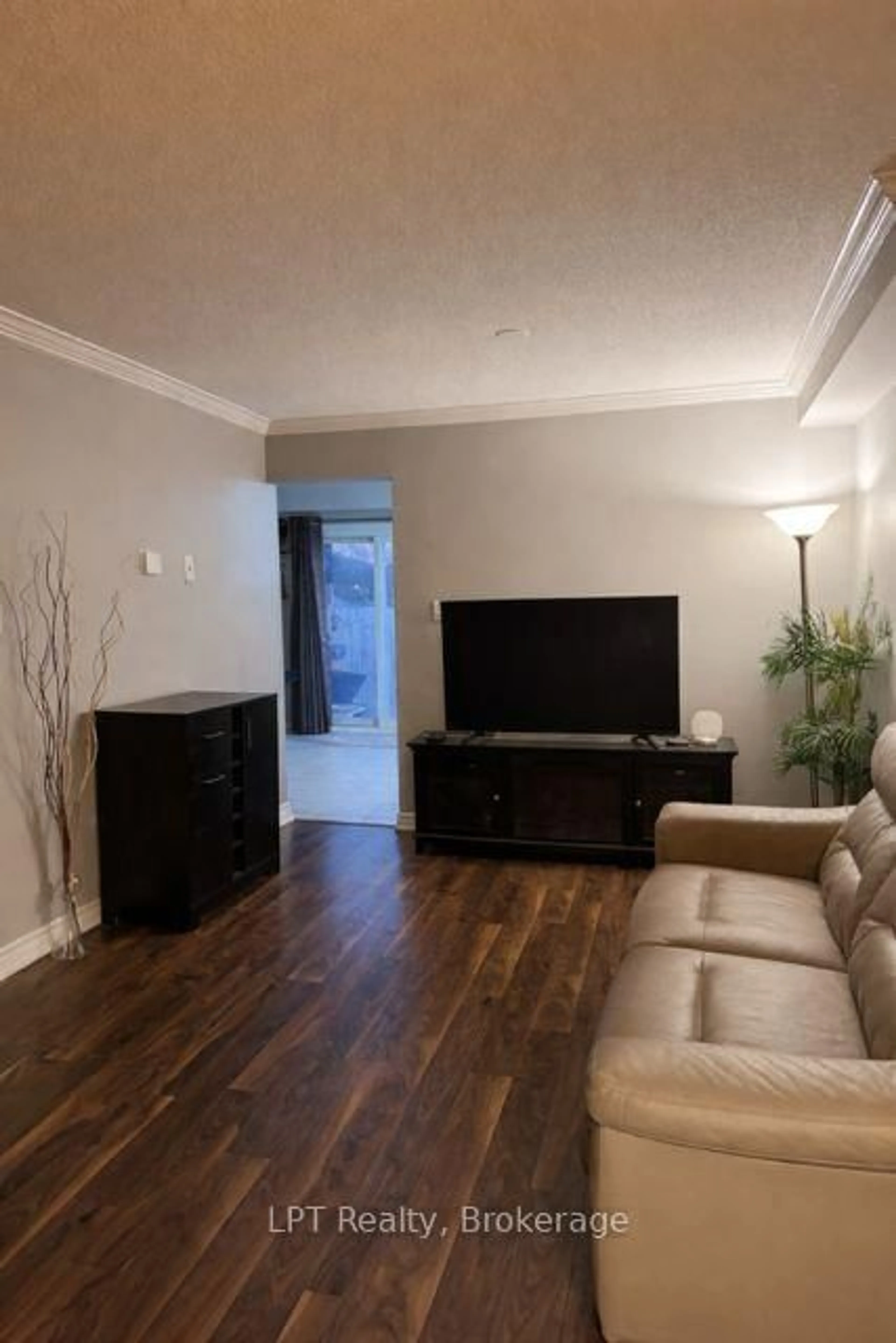 Living room with furniture, wood/laminate floor for 66 Landerville Lane, Clarington Ontario L1C 4Y1