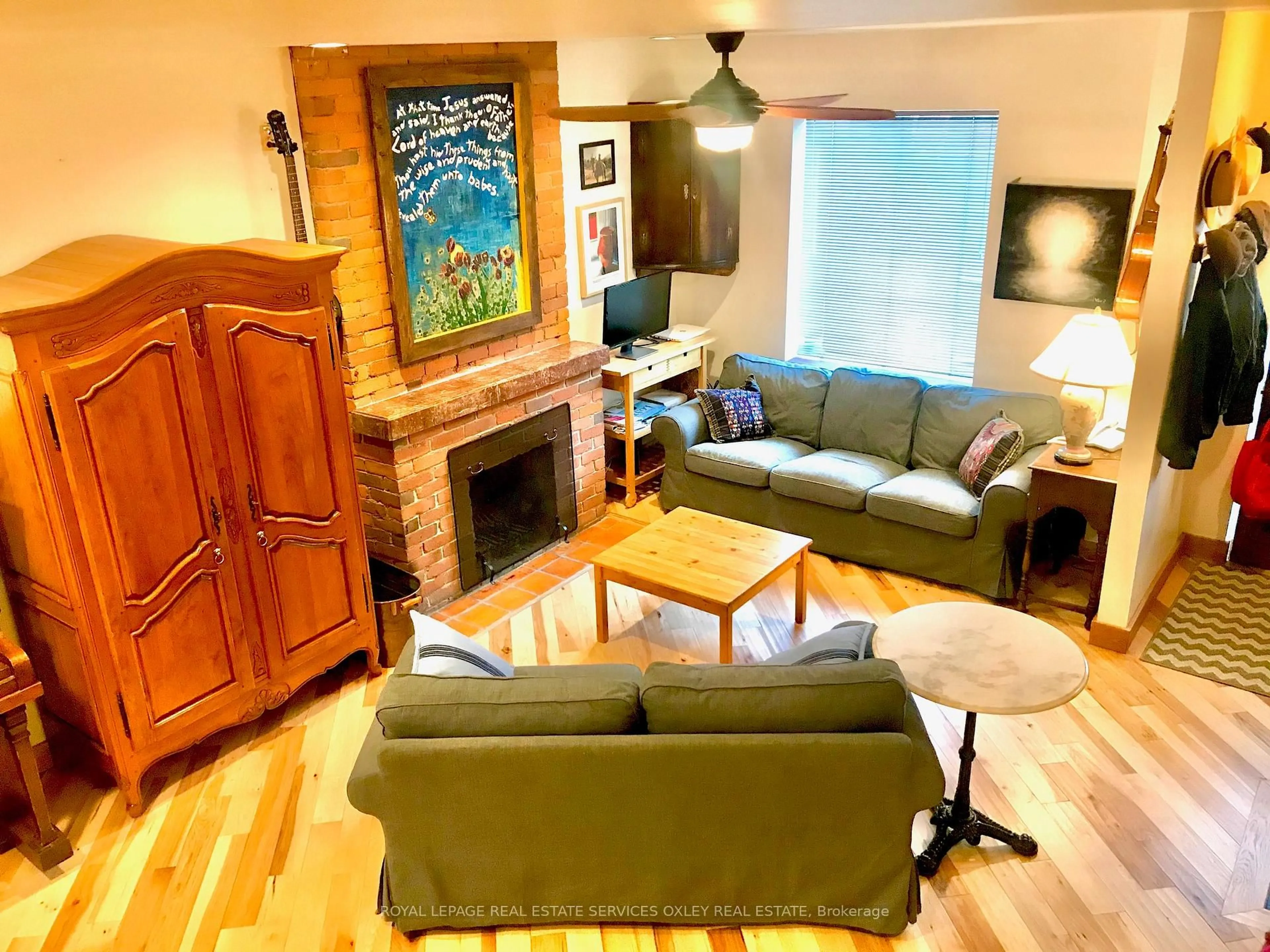 Living room with furniture, wood/laminate floor for 88 Prust Ave, Toronto Ontario M4L 2M8