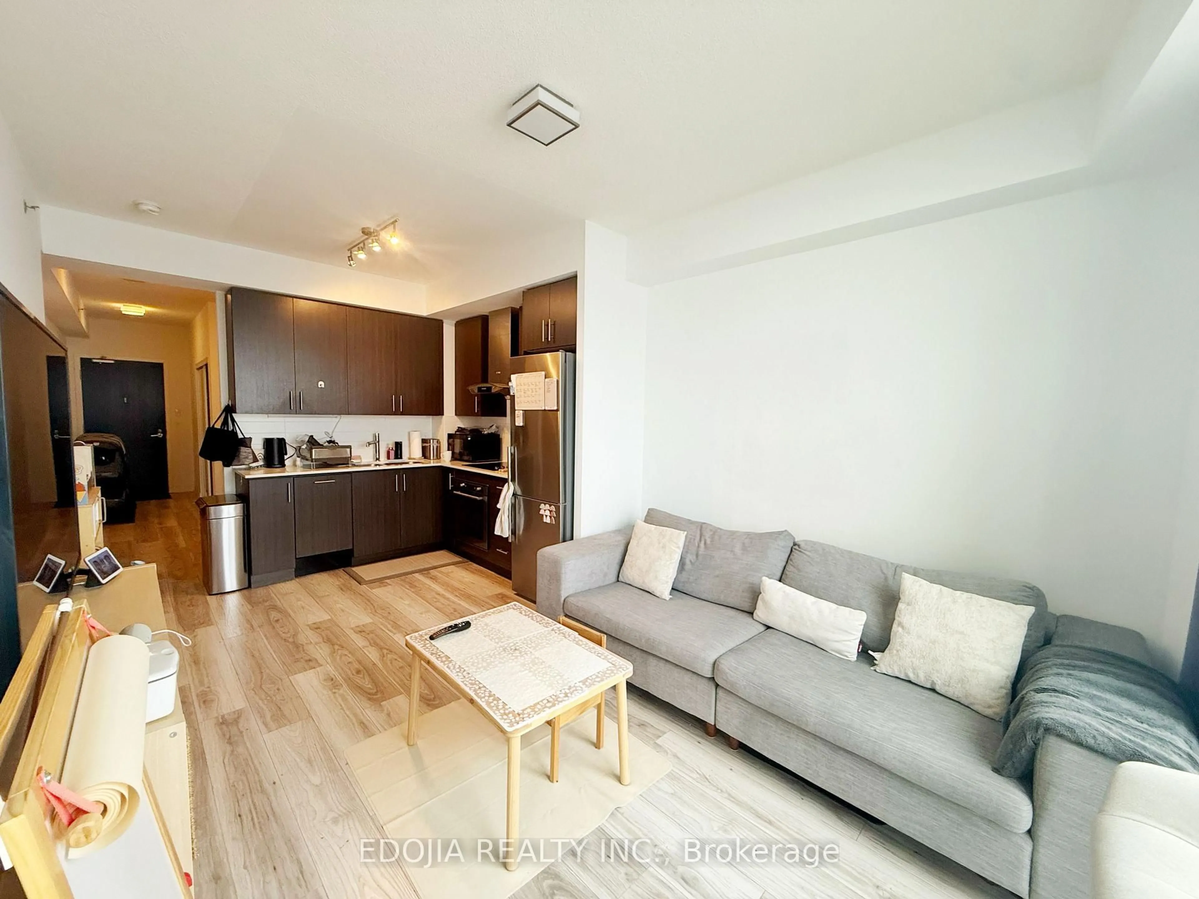 Living room with furniture, wood/laminate floor for 195 Bonis Ave #2113, Toronto Ontario M1T 3W6
