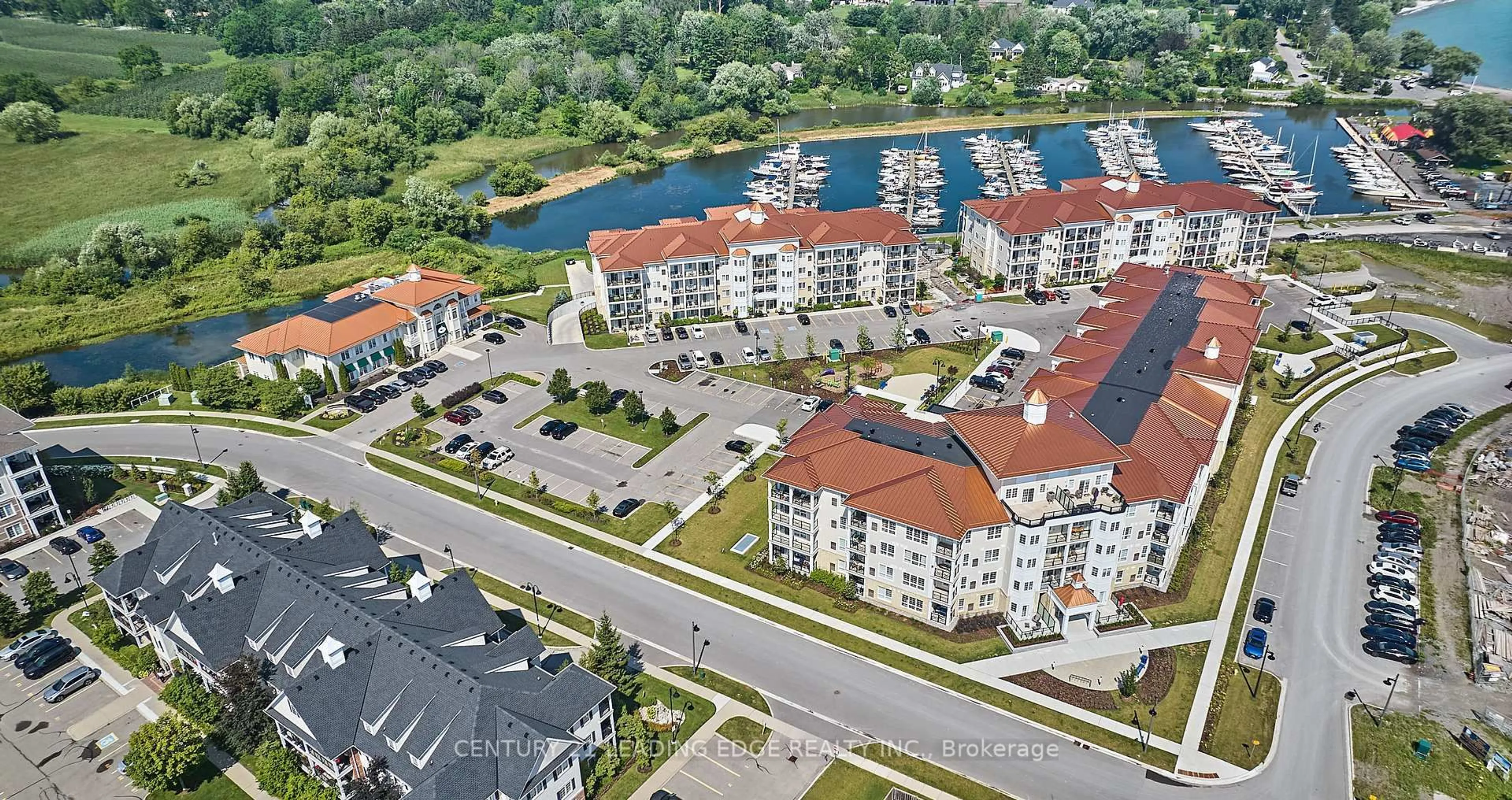 A pic from outside/outdoor area/front of a property/back of a property/a pic from drone, water/lake/river/ocean view for 50 Lakebreeze Dr #105, Clarington Ontario L1B 0V9