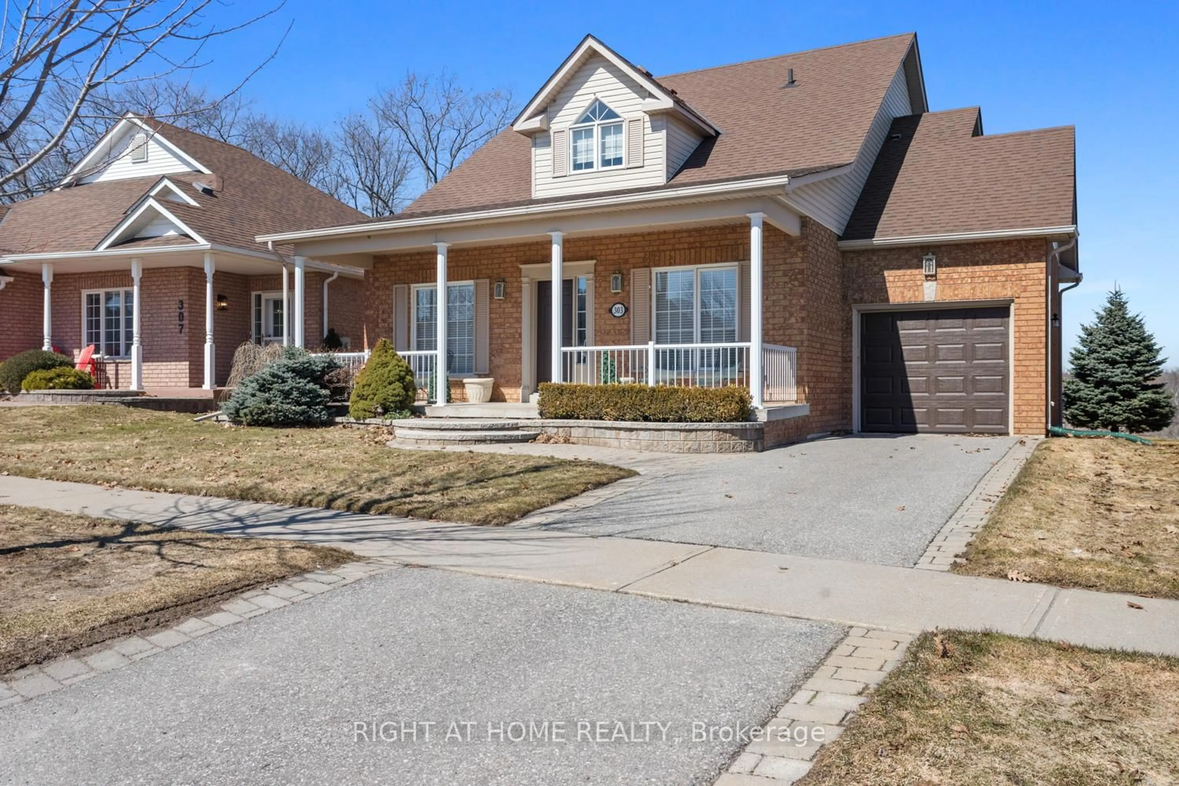 Home with brick exterior material, street for 303 WATERBURY Cres, Scugog Ontario L9L 1S5